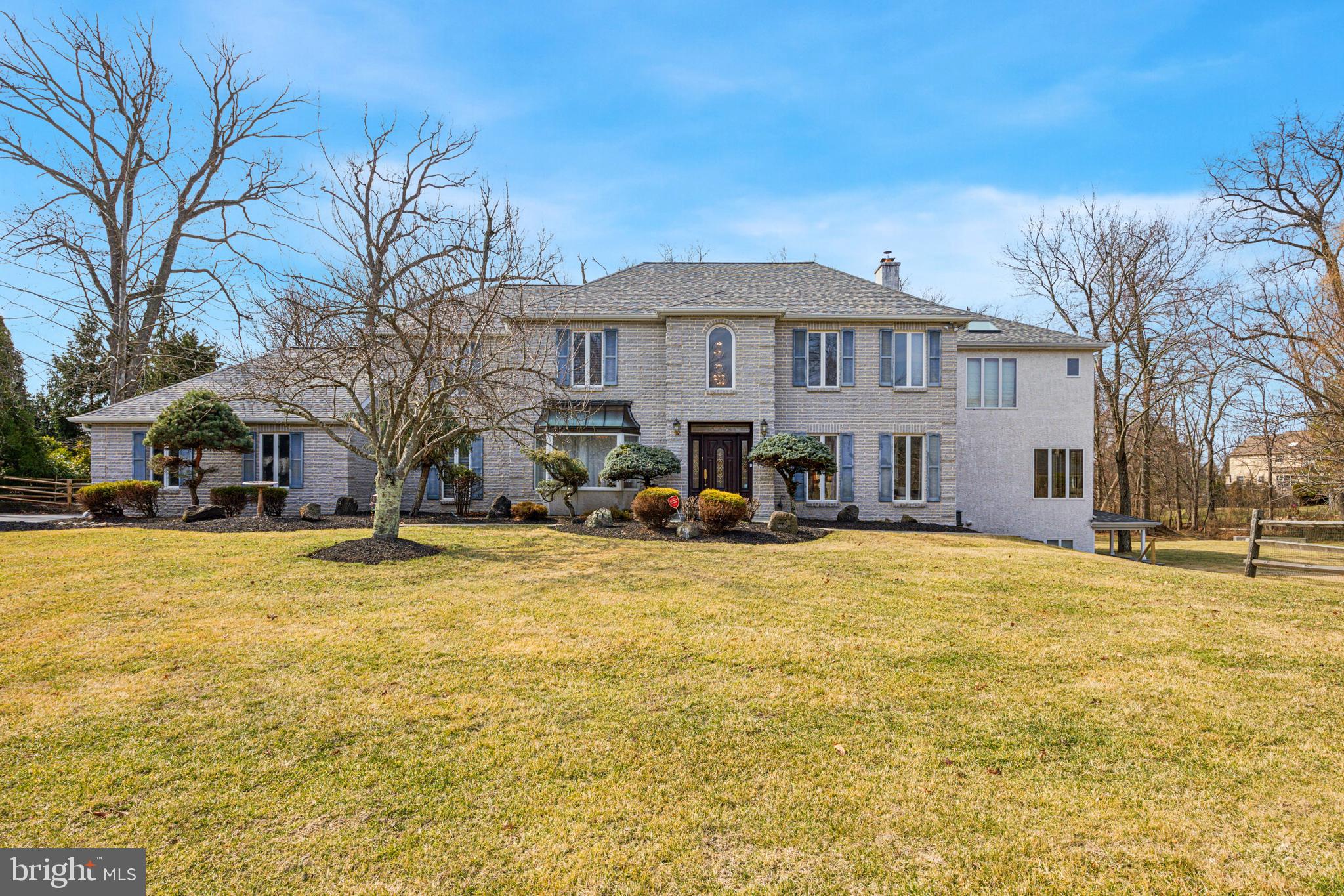 Magnificent, one of a kind, stately home in the heart of Bluebell on a beautiful one acre lot with mature landscaping. A home with endless possibilities. This sprawling beauty has everything for everyone - Elegance, Luxury, Privacy with an abundance of space. Impeccably maintained, with tastefully done upgrades this sun-drenched 5 bedroom, 4.2 bath home reflects pride of ownership and radiates positivity in every corner. The original home was redesigned and expanded by Architect Paul Macht. This East facing grand home features neutral decor and a two storey spacious entrance foyer with a large palladian window, which is flanked on either side by the stately formal living and dining rooms. A lavish kitchen that would be a chef's delight awaits you - spacious,w/granite countertops,gas cooking, 42" cherry cabinets w/tile backsplash, large granite island,recessed lights, a pantry room and more! A generously sized centrally situated breakfast room with its double height ceiling and stone gas fireplace is the heart of the home. The chandeliers in the foyer and dining room both have motorized controls for easy maintenance. Heated granite porcelain polished Italian tile floors in the foyer, living, kitchen, dining rooms w/ separate programmable controls. The expansive great room w/its own fireplace, is the perfect place to relax or entertain. The huge windows on three walls overlooking the serene landscape in all seasons is priceless. Both the breakfast room and great room connect to a rear bright foyer that leads to the massive deck and the back staircase that appears to have glass walls. The goregous sunlight streaming through and the quiet green backyard to behold is truly a charming feature of this lovely home. The deck is made of composite material with steps towards the driveway and backyard. Convenient guest bedroom on the main floor w/ Brazilian cherry hardwood floors and a full bathroom w/heated floors and shower stall. A mud room, laundry room, powder room complete this floor. The redesign and expansion allows this home the luxury of two primary bedroom suites on the second floor. Both elegant and comfortable. The new primary bedroom suite is its own separate wing of the home. Grand w/ 11 foot soaring ceilings, Brazilian cherry hardwood floors, balcony overlook to the yard, two walk-in closets, fireplace. The primary bathroom has heated floors, double vanity, two person capacity jetted tub, toilet w/ separate bidet, walk-in shower that is also a steam sauna w/thermostat controls. A beautiful well lit loft that overlooks the breakfast room connects this extension to the original second floor. The second primary suite has plush carpet, a sitting room, two closets, and bathroom w/ jetted tub, walk-in shower, double vanity, skylights and more. There are two additional well sized guest bedrooms and a guest bathroom on this floor. None of the bedrooms share a wall and every room has privacy. The lower level is also expanded so this home has two finished basements that interconnect beautifully. Both staircases can be accessed from both basements. The new basement has tile floors, is walk-out, is well lit and has a powder room as well. The original basement is large, with plush carpet and lots of room for storage. Recreation room, exercise room, media room, office to work - these finished open spaces offer many flexible options. And that is not all. Several rooms and hallways in the home have smart bulbs that can be operated with voice commands over smart devices. A 20KW whole house generator that runs on propane can power the home for heat/electric for upto 45 days with a mobile link feature. New Roof 2022. Whole house security system w/cameras front and back. Blue Ribbon Wissahickon School District. In addition to its idyllic setting on a premium lot, this home is conveniently situated from all highways, shopping, places of work, schools and more. A rare opportunity to own a gorgeous unique home. Schedule your private tour today !