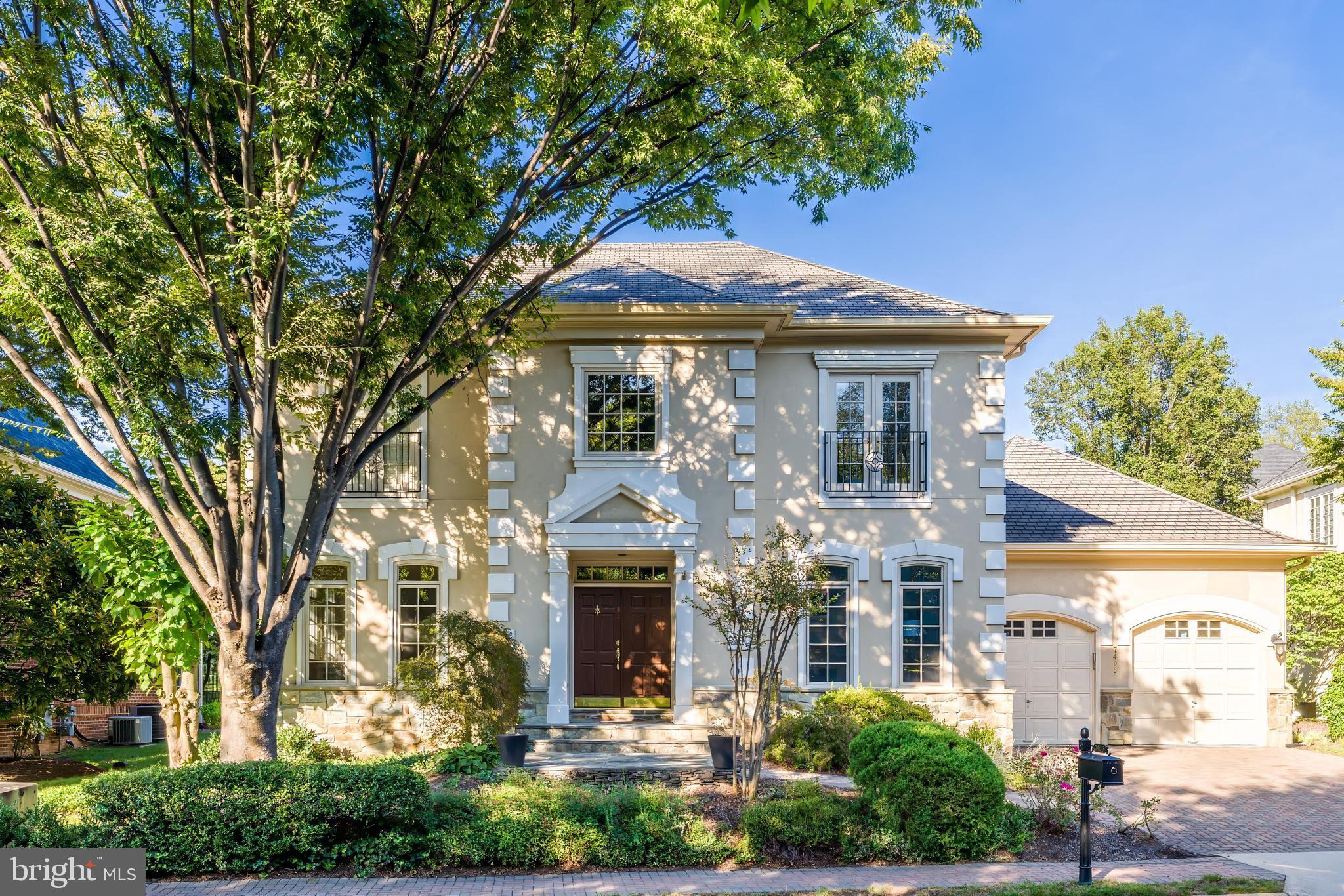 Nestled within the gated Maplewood enclave, a private community of just 32 homes, this residence features a distinctive floor plan with a highly desirable main level primary suite, architectural presence, and a prime inside-the-Beltway location with convenient access to Tysons, the Silver Line Metro, major commuter routes, shopping, dining, and parks, offering exceptional convenience for both local and international lifestyles. A dramatic two-story foyer with circular staircase and soaring 12-foot ceilings, together with the main-level primary suite, sets the tone for the home’s scale and understated elegance.
The main level is thoughtfully arranged for both formal and everyday living, featuring the primary suite with fireplace, sitting area, and two closets, one with built-ins. Formal living and dining rooms are balanced by a spacious family room with fireplace opening to a large deck, while the kitchen includes a breakfast nook. A den/office with built-ins adds versatility, and a mudroom and laundry room with sink and cabinetry (hookups) provide access to the garage.
The upper level includes three generously sized bedrooms, including a secondary en suite, offering comfortable accommodations for family and guests.
The lower level provides functional, flexible space for entertaining or recreation, with a full bath and a bedroom with legal egress window and ladder access to the backyard. A dedicated bar area, generously sized storage space, and additional laundry room further enhance the space.
A compelling opportunity to own in one of McLean’s most sought-after gated communities.