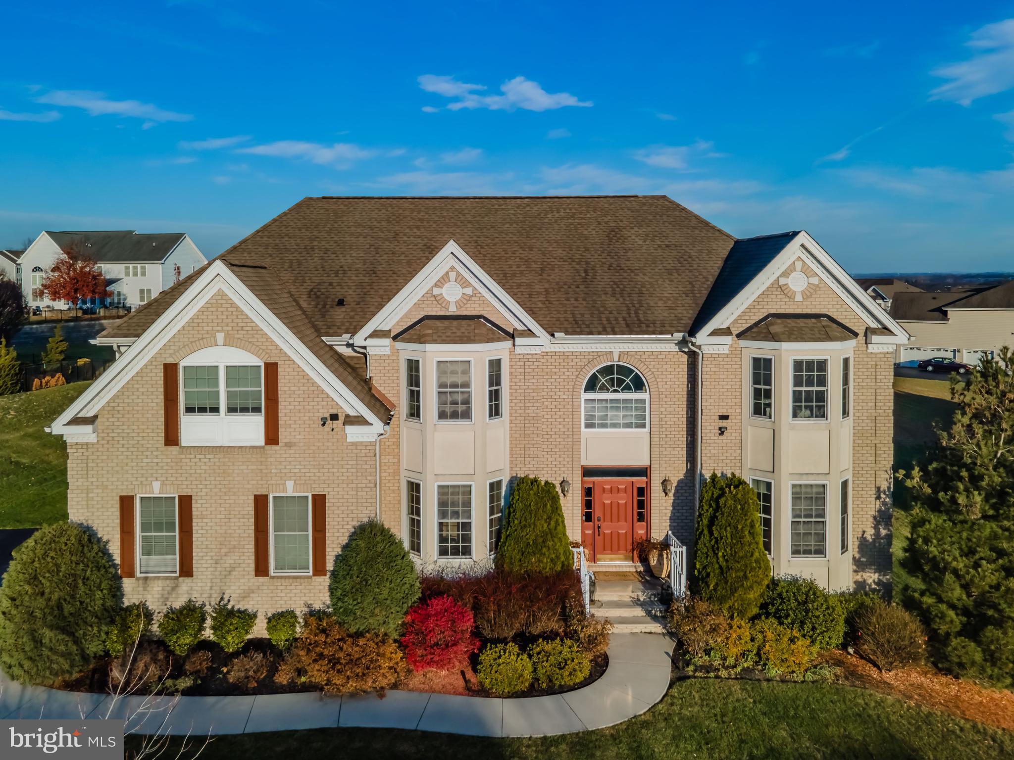 Here is your chance to own in the Bella Vista development, nestled within the highly coveted Cumberland Valley school district. This magnificent 5-bedroom, 4.5-bathroom residence is a perfect blend of  space, and functionality.

As you enter through the grand two-story foyer, the warmth of the home envelopes you, immediately showcasing the elegance of the front formal living room and dining room adorned with gleaming hardwood flooring. The family room, boasting a gas fireplace and dramatic 20' ceilings, is a focal point that is both inviting and awe-inspiring. The kitchen is equipped with a center island, a walk-in pantry, and adjoining breakfast/dining rooms that provide ample space for both meal preparation and entertaining. The main level also features a versatile office, ideal for a productive work-from-home space or conveniently used as a fifth bedroom.

Journeying to the second level, discover a thoughtfully designed layout with four bedrooms. Two generously sized bedrooms share a full bath in the hall, catering to the needs of bedrooms 3 and 4. Bedroom 2 enjoys the luxury of an ensuite bath, while the opulent owner's suite steals the spotlight with a full-size sitting room, tray ceiling, his and her walk-in closets, and an oversized primary bath featuring a dual vanity, jacuzzi tub, and tiled shower.

For added entertainment and recreation, the full basement extends the living space, offering a large open area for a second family room and game room completed with another guest room and additional full bath  ensuring your home is always ready to host friends and family.

This residence truly encompasses the essence of luxurious living, with its well-appointed spaces, thoughtful finishes, and the perfect blend of comfort and sophistication. Don't miss the opportunity to make this exceptional property in Bella Vista your new home.