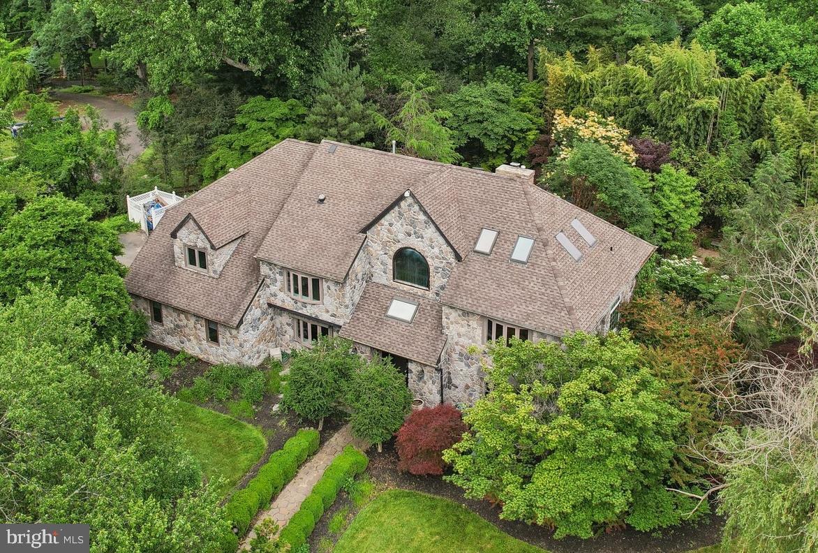 Welcome to 570 Penllyn Blue Bell Pike in the heart of Blue Bell and the award winning Wissahickon School District.  Tucked away on a private cul-de-sac and set back from the road, this custom-built colonial is situated on just under an acre of beautiful land adorned with mature trees. This updated home with exquisite stone facade home has 5-bedrooms, 3 full baths, and 2 half baths, and is completely move-in ready. 

The home offers generous living spaces, both inside and out, including a multi-tiered deck, a large in-ground pool, and a hot tub. Step inside to find a freshly painted interior illuminated by recessed LED lighting throughout. The grand foyer welcomes you, flanked by a formal dining room with a built-in buffet on the left and a spacious living room on the right. The vaulted family room, featuring a floor-to-ceiling fireplace, is bathed in natural light and boasts hardwood floors. The updated kitchen is a chef's dream with dark cherry cabinets, granite countertops, and a tiled backsplash. It is fully equipped with stainless steel appliances, including a 5-burner cooktop and dual ovens. Adjacent to the family room, a versatile room with new french doors and perfect for a home office awaits, complete with its own private deck overlooking the serene backyard. A conveniently located half bath is found near this room and a second half bath is located on the other side of this floor near the garage entrance.  The attached oversized two car garage features loads of storage space, a newly epoxied floor, and freshly painted walls.

Upstairs, the expansive master suite is a true retreat. It features a vaulted ceiling, brand new hardwood flooring, and recessed lighting. The luxurious ensuite bath has been completely remodeled with a double vanity, soaking tub, walk-in shower, and elegant champagne bronze fixtures. Down the hall are four additional spacious bedrooms, three with new carpeting and one with cherry hardwood flooring and a large walk-in closet. The hall bathroom is equally impressive with modern finishes, a brand-new tile stand-up shower, tub, and double vanity with matte black fixtures.

The finished walk-out basement offers endless possibilities with new luxury vinyl tile flooring, a full bathroom, a sauna, and a gym room. Outside, the recently refinished multi-tiered deck leads to the inviting in-ground pool and hot tub. A new gazebo provides an additional outdoor living space.

Situated in an idyllic location surrounded by other custom homes, this property is a special find and fantastic value with just over 5,400 sq feet of living space across three finished floors of the home.  Blue Bell consistently finds its way on many lists of the best places to live in Pennsylvania with convenient access to area highways and a vibrant local restaurant scene only minutes to Ambler’s main street offerings.  Come see what 570 Penllyn Blue Bell Pike has to offer and schedule your showing today.