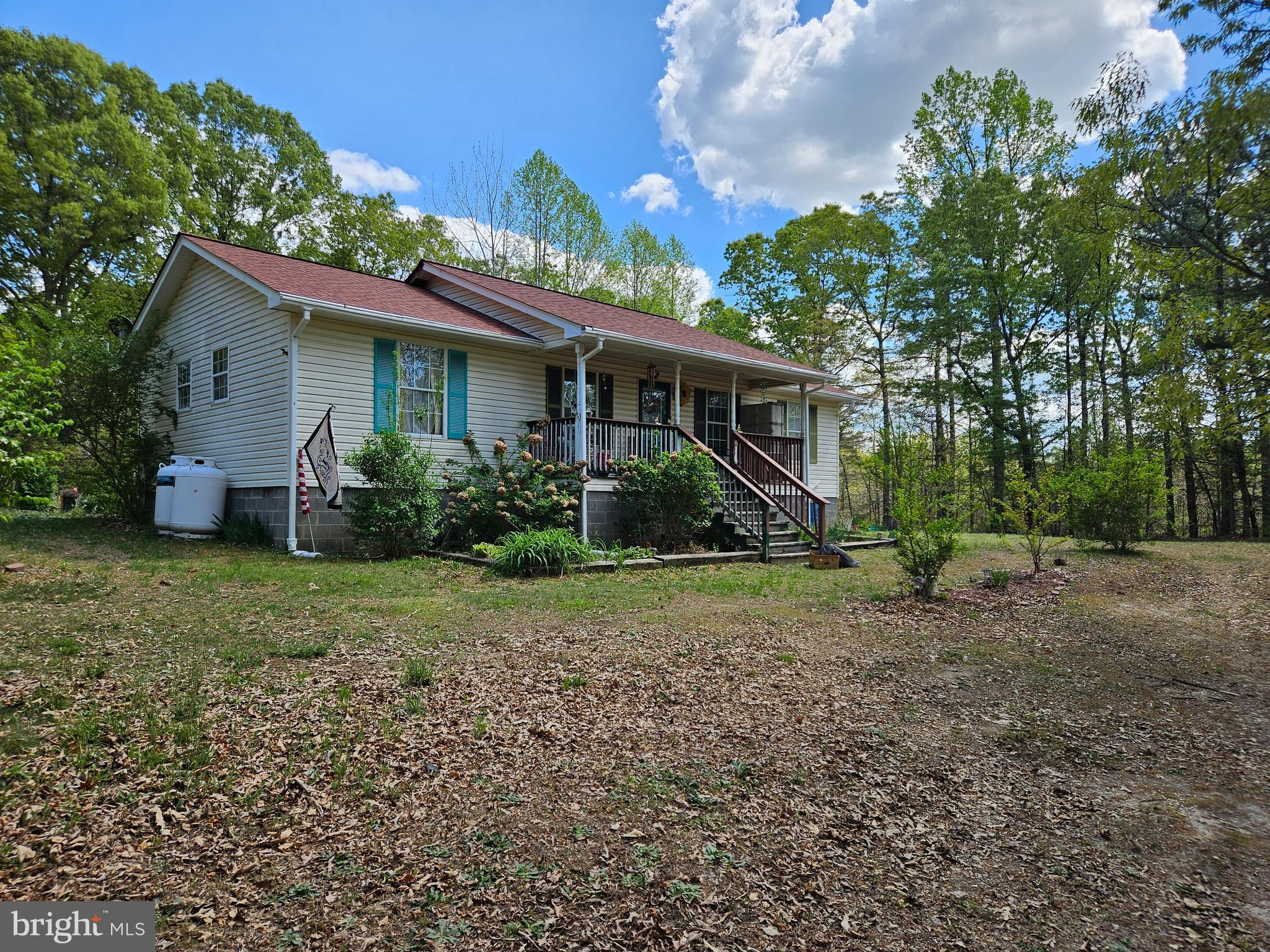 Handy person!!! Work and save. Needs cosmetic work. Peace all around. Surrounded by other wooded parcels. Ideal for ATV's, dirt bikes, hunting, or other activities on the land.  Sandy soils with room for gardening. Located about .8 of a mile from Ruther Glen Road. 1.9 miles from Rt. 207 (Rogers Clark Blvd.) 2.2 miles from I-95. 3 miles from Rt. 1. Great for commuters North and South. Close to dinning, truck stops, fuel stations, McKesson, and other employers. No HOA. The seller installed a 50-year warranty, roof shingle approx. 3 years ago.