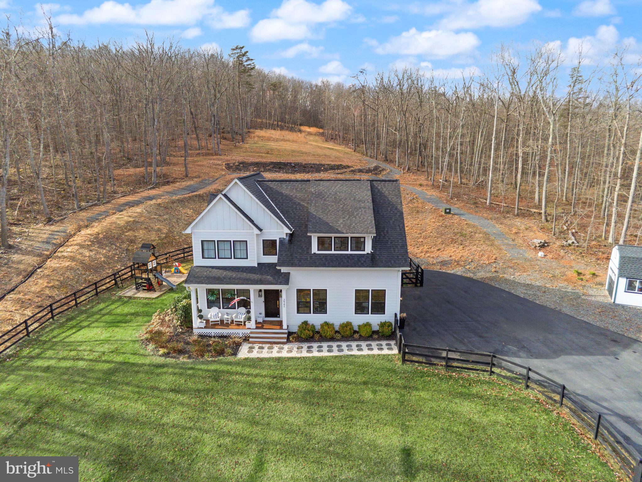***Back On the Market ***

Welcome home, a place to relax, feel safe, belong!

A private 10-acre Aldie estate thoughtfully curated and designed as a peaceful countryside retreat.

Set across ten breathtaking acres with NO HOA, this extraordinary custom-built residence by MAC Builders offers the rare opportunity to experience refined estate living surrounded by nature. Mature trees, open skies, and sweeping views create an atmosphere of calm and privacy while the home reflects timeless craftsmanship and thoughtful design.

Inside, a light-filled open floor plan unfolds with effortless elegance. The gourmet white kitchen, complemented by an expansive pantry and exceptional storage, flows seamlessly into the inviting family room anchored by a warm gas fireplace and the open dining area, creating a beautiful space for both everyday living and entertaining.

A main-level bedroom with a full custom bath provides the perfect setting for guests, extended family, or multi-generational living. Just beyond the living spaces, a covered porch invites you to slow down and enjoy quiet mornings, peaceful evenings, and uninterrupted views of the surrounding countryside.

Upstairs, the home offers four spacious bedrooms and three and a half baths, including a stunning primary suite designed as a private retreat. Wake to serene views and step directly onto your private upper-level deck overlooking the property. The spa-inspired primary bath features dual vanities, a freestanding soaking tub, a beautifully designed custom shower, and an impressive wrap-around walk-in closet. An upper-level laundry room adds everyday convenience.

The walk-up lower level expands the home’s lifestyle offerings with a large recreation area, custom bar, an additional bedroom, and a full bath, along with a custom-built playroom designed to inspire fun for all ages.

Outside, the property continues to impress with a fully fenced front yard, two-car garage, and a custom-built shed that can serve as a secondary garage, workshop, or additional storage space. The outdoor playset conveys with the home, adding another wonderful feature to the expansive outdoor setting.

Served by private well and septic, this remarkable property offers the rare combination of acreage, privacy, and modern luxury while remaining just minutes from Aldie, shopping, dining, commuter routes, and the best of Loudoun County living—and just 10 minutes from Middleburg, offering convenient access to its charming shops, restaurants, and historic small-town atmosphere.

A truly special Northern Virginia countryside estate where every sunrise feels peaceful, every gathering feels special, and every day feels like coming home.