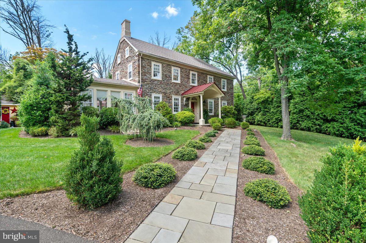 Standing with regal beauty and steeped in history, this stone house is an extraordinary preservation of the original Manor House built in 1801 for a wealthy landowner. Major renovations and restoration work were done in 2005.  Included were new electrical wiring, plumbing, and roof. The character and details of the original house blend with every modern convenience to create a gracious and elegant home. In immaculate condition and truly move-in ready, it is sited on more than four acres. A distinguished covered entrance into Curley Mill Manor is prelude to what awaits you. Filled with architectural and special features, this home was once a Bed & Breakfast and the four upstairs bedrooms all have bathrooms. Most of the first floor has 9’ ceilings, in itself a wonder for a 222 year old house. From the living room step into a cozy 11 window sunroom bright with natural light and a door to the outside. A large dining room was always prevalent in houses in the 1800s and this one doesn’t disappoint. Stunning custom built cabinetry in the kitchen includes a serving center, granite countertops, a wide peninsula with farm sink and seating for four, and a door to another side of the house. Off the kitchen is the mudroom/laundry with access to the foyer and an exterior door to the exquisite bluestone patio.   From the kitchen step up to a back staircase that brings you to the private main bedroom and bath or step down into the enormous family room with exquisite custom milled floor and beam and a propane fueled fireplace.   A coat closet and powder room are also in this multi-purpose area. You’re not done yet! In 2008 an unfinished area of concrete floor and partial walls was turned into an enclosed porch with plexiglass windows and screens, a vaulted wood ceiling. An exterior door leads to the patio through a hidden path under evergreen trees.   An original staircase in the foyer takes you up to four spacious bedrooms all with their own bath. Three are ensuite and one just outside in the hall. This beautiful property is a treasure that includes an unattached garage/barn that can accommodate four cars and two horses and has plenty of storage room. There is also a gazebo, a charming well house, extensive hardscaping and exquisite landscaping plus a circular main driveway and an additional driveway to Curly Mill Road. Privacy, stunning ambiance inside and outside, updated, and convenient location to commuting routes, shopping, dining, entertainment and recreation (5 minutes to Peace Valley Park for hiking, canoeing/kayaking ). Welcome home to history, gracious living, and a distinguished residence.