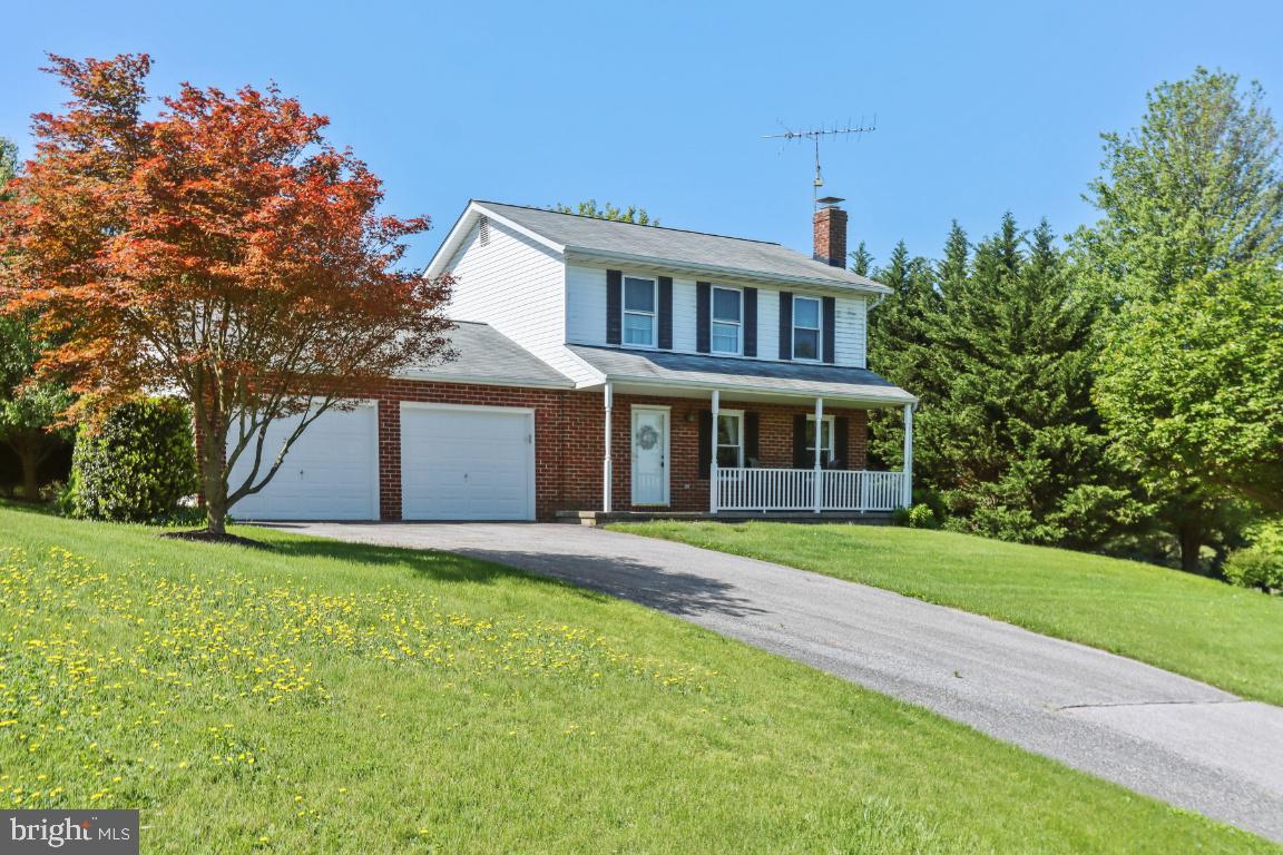 Beautiful 3 bedroom  well kept Colonial with 2 car garage.. This home is the perfect starter home with hardwood floors,  Remodeled bath, Fully finished Lower Level, Nice sized kitchen with table space.  The 1.5 acre lot is absolutely Gorgeous..Don't miss this one