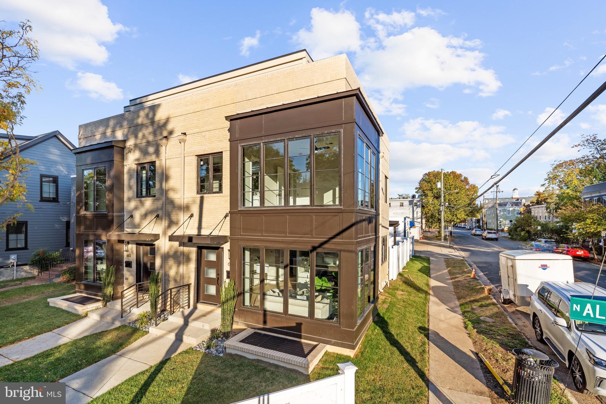 Welcome to 601 N. Alfred Street, a RARE level of luxury living in Old Town!  
Built in 2022, this four level, 4 bedroom, 4.5 bath, sparkling, sun-drenched, pristine new build exceeds any of your lifestyle aspirations.  Architectural highlights abound with sleek, striking modern design. 
Live with luxurious high-end fixtures and features including wide plank Oak flooring on 3 levels.  Oversized, floor to ceiling black-framed windows provide incredible natural light.  
As you enter this custom residence, take in the beautiful gas fireplace enveloped in a 3-D marble surround, custom built-ins, high ceilings, and floor plan perfection.  The chef’s kitchen boasts custom white cabinetry, quartz countertops including a waterfall island, Stainless Steel GE Café Appliances, Microwave drawer, Pantry, Stainless Steel farmhouse sink, and deep drawer basins. Enjoy Regal Blue accent lower cabinets in the breakfast bar seating area, a separate dining area and a cozy office nook. 
The main living level additional highlights include a convenient powder room, Sonos enabled, smart box speakers and wiring for cable and Internet. Enjoy easy access to the fully fenced back yard showcasing a trellis patio, lush green lawn, private parking for two cars enclosed in a white picket fence with secure gate. 
The first bedroom level features two en-suite bedrooms including the Primary Bedroom Suite with a gorgeous primary en-suite with a freestanding soaking tub and oversized custom-tiled shower. 
Walk up one level and take in another en-suite bedroom and a stunning and rare roof-top terrace.
The lower level features a family room, or 4th bedroom, another beautiful full bathroom, laundry, storage, and mechanical rooms.
This is a rare and unique opportunity to entertain your family and friends in modern style while embracing the fabulous Old Town lifestyle. Enjoy history, small town feel, and walkability in a stunning water-orientated and vibrant community.  Blocks to King Street’s nightlife, shops and restaurants.  Walkable to the revived Alexandria Waterfront and the King Street and Braddock Road Metros.  Wonderful location providing easy commuting options to the District, The Pentagon, The George Washington Parkway, and all major highways.  Welcome home!