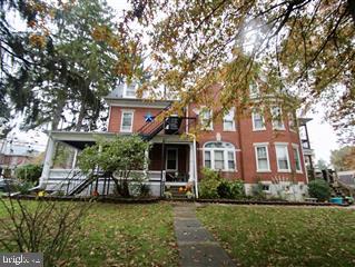 1900 brick home converted to 3 units while maintaining the original woodwork, stained glass windows, open stairways, built ins and more. 2 units offer new kitchens. Detached garage/barn can be used by owner, incorporated into rents or rented separately. Perfect to live in one and rent 2 or rent all units. Main unit is 1st and 2nd floor with large laundry, LR and FR, 3 Br, new HW floor 2nd floor and room to stretch...currently owner occupied. 1st floor efficiency great for in-law or rental. large 2 Br unit on 2/3 floors could house 4 college students easily for more rental income($300/student easily). Lots of charm and lots of possibilities.