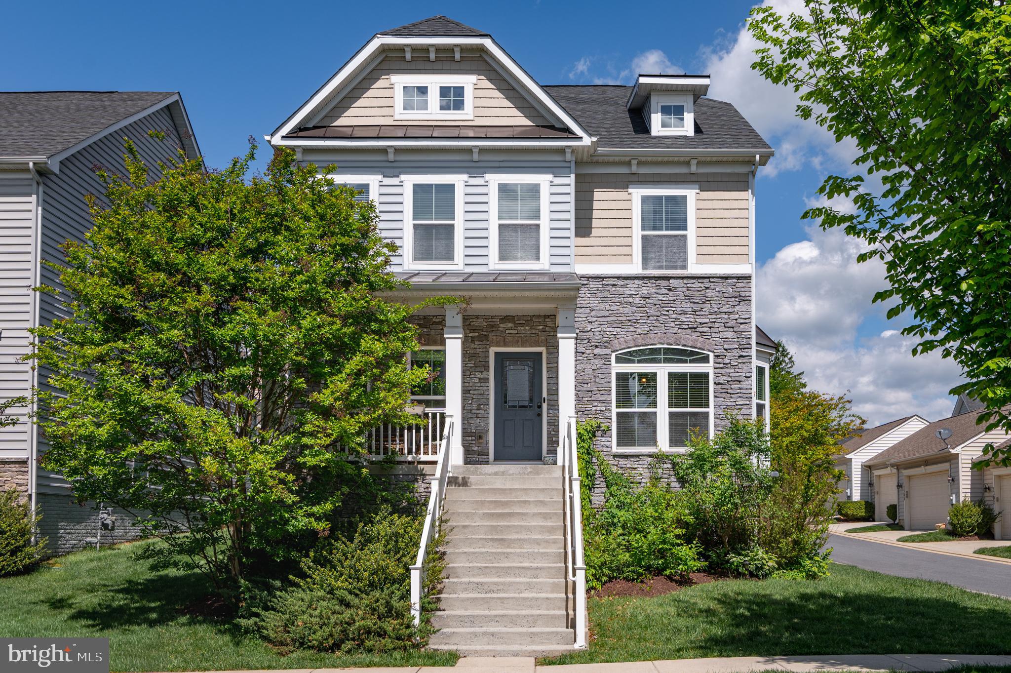 Beautiful John Steinbeck model with four finished levels including a bonus 5th bedroom and full bath on the top level! Upgraded elevation with front porch and stacked stone is sure to impress! Fenced backyard and patio too! Once inside you are greeted by brand new wide LVP on the entire main level!  There is a formal dining room, and a large study with French doors and bay window flanking the hallway which leads into a very large kitchen with new stainless steel appliances, freshly painted cabinetry and a super-sized island with plenty of seating possibilities. This amazing kitchen which is the heart of the home, opens up to the family room with cozy gas fireplace and breakfast room with practical direct access to the oversized 2-car garage in the back of the home.  Upstairs you have 4 bedrooms including the spacious primary suite,  second bath and laundry room. One more flight up is a loft/5th bedroom with full bath.  The basement is fully finished with a wet bar and lots of space to hang out with family and friends, as well as a bonus room that can be used as a 6th bedroom, guest room, hobby room, second office etc. There are built-in speakers in several rooms on the main level and basement level, as well as on the patio. Great location close to the shopping center and amenities. Brunswick Crossing is the place to be with resort-style swimming pool, walking trails for miles, tennis courts, dog parks and much much more. Easy commuting with the MARC train right here in Brunswick!  Make this home yours before someone else does!