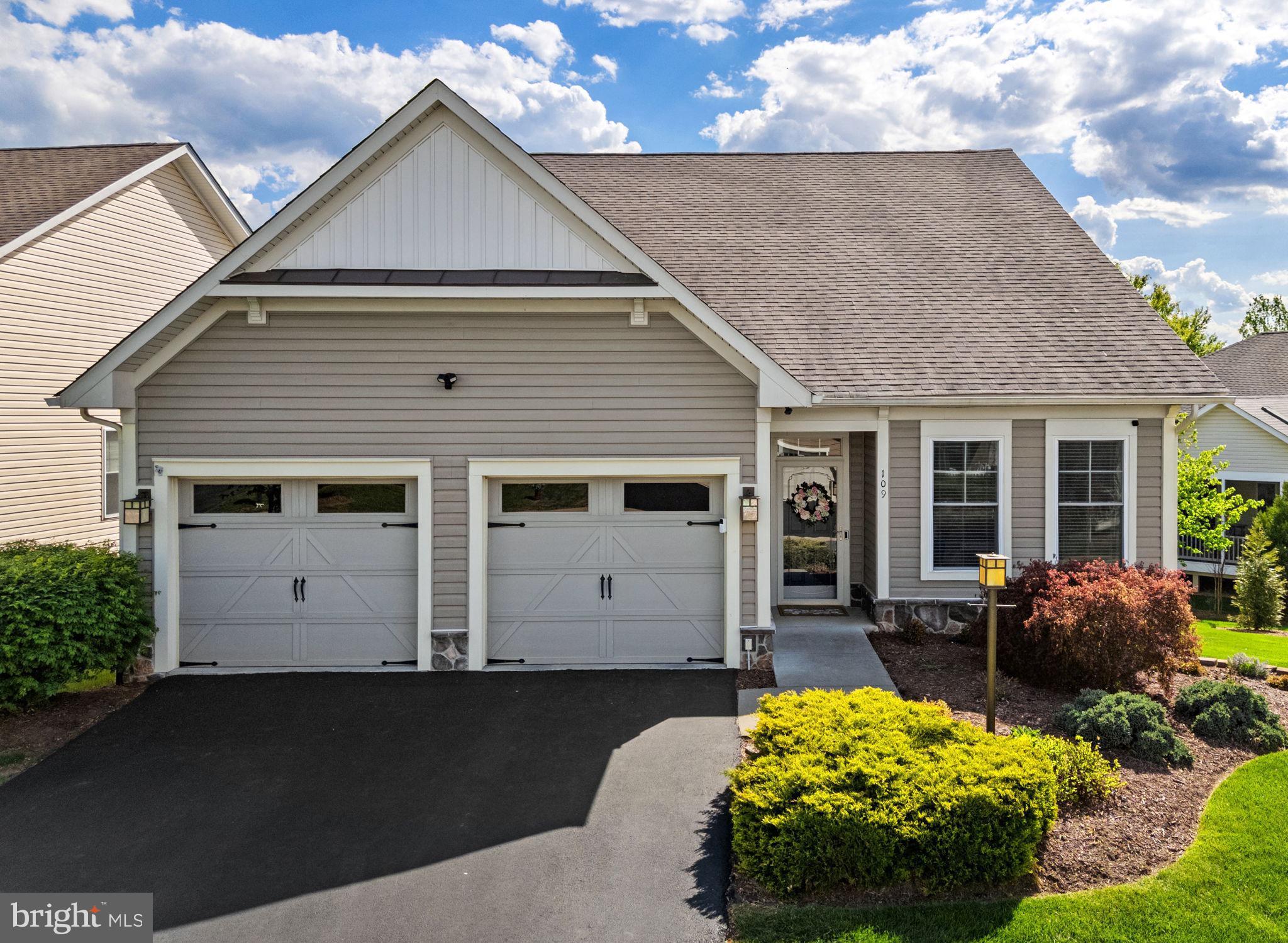 Great home. Great neighborhood. Even better price!! Welcome home to 109 Tutelo Lane, an immaculately maintained ranch-style residence nestled in the premier 55+ community of Trilogy at Lake Frederick. Boasting incredible curb appeal with lush greenery and mature trees, this residence is just steps from the lake and offers a lifestyle defined by luxury and convenience.  The exterior serves as a private oasis, featuring a rear Trex deck with elegant white railings, a lower-level brick patio, and a pristine yard enclosed by premium white vinyl fencing. Inside, the freshly painted interior is bathed in natural light, showcasing a sophisticated floor plan that begins with a versatile formal living room off the foyer. This space flows into a striking formal dining room wrapped in a rich navy-blue, providing a beautiful backdrop for hosting guests, before entering the heart of the home: an expansive, open-concept family room and gourmet kitchen.  A chef’s dream, the kitchen features a massive quartz island with integrated seating, stainless steel appliances, a corner pantry, and a sun-drenched breakfast area where glass doors open to the deck for effortless indoor-outdoor dining. The main level is designed for effortless living, highlighted by a sprawling primary suite with a large walk-in closet and a gorgeous, recently updated ensuite bath. This spa-like space is anchored by an extra-long vanity featuring upgraded countertops, sleek dual sinks, and an impressive amount of cabinet storage and drawer space, all complemented by a massive walk-in shower with exquisite custom tilework. A second spacious bedroom, a full guest bath, and convenient laundry facilities complete the first floor. Head downstairs to the expansive walk-out finished basement, where the possibilities are endless. This level features a large recreation room with built-in cabinetry, a versatile den/bonus room, a sizable half bath, and a dedicated hobby/craft room currently outfitted with incredible storage and workspace—perfect for a playroom, home office, or gym. Modern essentials are already in place, including a security system and satellite dish, plus an attached two-car garage finished with sleek epoxy-coated flooring. Trilogy at Lake Frederick offers an unparalleled resort experience right at your doorstep. You will enjoy exclusive access to the world-class Shenandoah Lodge, award-winning dining at Region's 117, a state-of-the-art fitness center, and both indoor and outdoor pools. Whether you are taking advantage of the sports courts, dog park, or the miles of scenic walking trails and lake access, the amenities are truly unmatched. Perfectly situated near major commuter routes, shopping, and dining, this home offers the ideal balance of tranquil lakeside living and modern accessibility.
