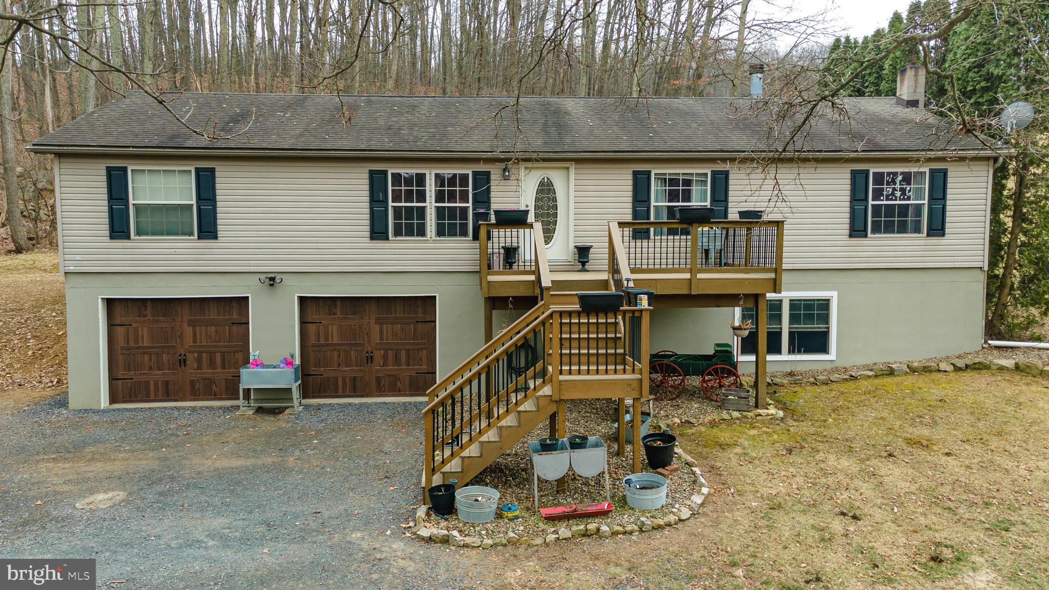 Escape to the beauty of country living in this stunning 3-bedroom, 2.5-bathroom home, offering breathtaking mountain views in the West Perry School District.  This home combines modern upgrades with rustic charm, including a wood burning fireplace in the main living area for those chilly nights. Cut your heating costs next winter by using the wood stove located in the basement. This house has been recently renovated and is move in ready! You will enjoy the updated kitchen, included stainless steel appliances and remodeled bathrooms on the main floor as well as new windows and a sliding glass door leading out to the large poured concrete patio. It has a spacious 2 car garage with inside access, a large partially finished  basement area with plenty of storage. Conveniently located 5 minutes from the town of New Bloomfield, 15 minutes from Little Buffalo State Park, and under 40 minutes to Harrisburg.  You don't want to let this one get away!