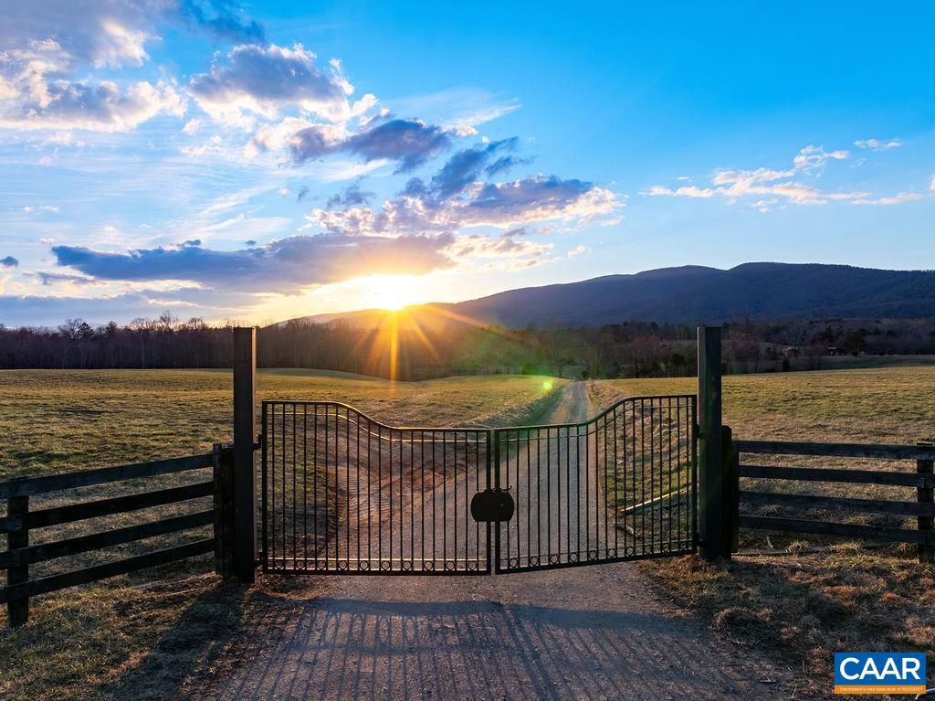One-of-a-kind ESTATE PARCEL with spectacular, panoramic views of the Blue Ridge Mountains. The property consists of 4 tax map parcels totaling 81.45 acres.  Property is predominately open with fencing in-place, several springs and gently rolling pasture. Barn plus several other outbuildings. Entire property has 18 division rights making it a candidate for a conservation easement. This is a stunning location within the county of Western Albemarle. Under 10 minutes to downtown Crozet.