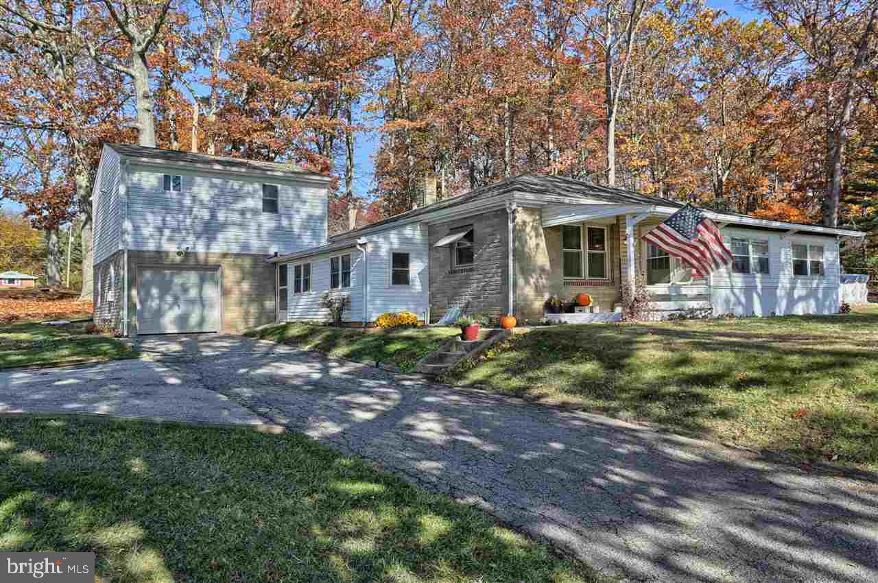 The sky is the limit with the options and possibilities with this well maintained rancher that sets on nearly two acres of land and has one of the most convenient locations available!  Beautiful views of the surrounding farmlands as well as privacy with the wooded section of the land! A perfect place to add on to if your future plans desire!  Inside the home is very welcoming and has the charm you would expect! A great find at this price!