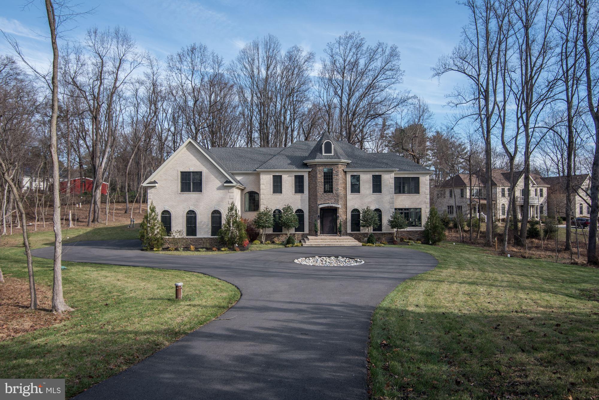 NEW HOME in the Churchill School District! Enter down a long, private drive to this fabulous home offering five bedrooms up, one on the lower level, and an option to create a large main floor bedroom out of existing sunroom that has its own full bath.  Top of the line materials used in the kitchen and baths, two gas fireplaces, media room, walk out main level to private, rear yard.