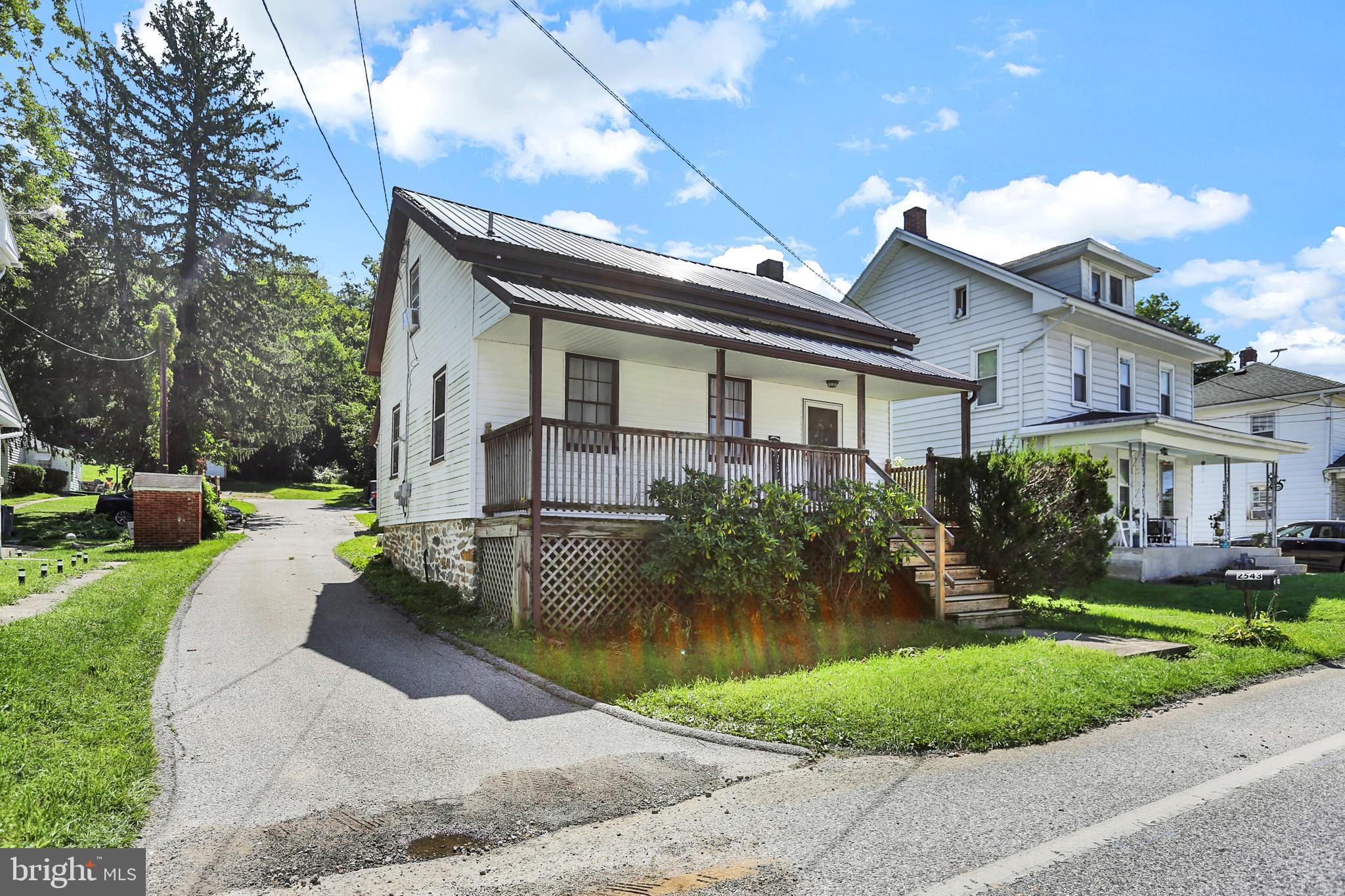Don't miss this cape cod in Central School! 2 bedrooms and 1 full baths. Brand new metal roof and furnace. Covered porch off of kitchen leading to a large backyard.  Right on Sherman street you’ll enjoy the convenience of off street parking.  Inside a Master bedroom features a large walk-in closet. On the first floor a , comfortable family room with brand new high end laminate flooring. The exterior features a spacious backyard perfect for activities and entertaining. There is also a very large 2 story utility shed (500+ sq ft). Convenient to I83! Perfect for first time home buyers or someone looking to downsize. 100% Move-in Ready!