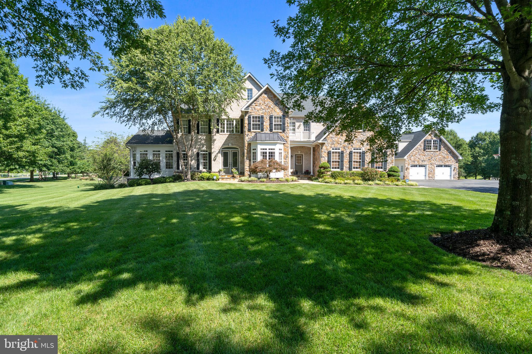 Welcome to your dream estate in the highly sought-after Dunkirk location in Northern Calvert County! This 6-bedroom, 5 full and 2 half bath residence offers over 7,700 sq ft of luxury living, a fully finished basement, home theatre, detached garage, and a resort-style pool—truly a home with everything you need PLUS more! From the moment you arrive… you’ll be captivated by the stunning curb appeal: stone and brick exterior, a grand circular driveway with tons of parking, a fenced lawn with a dedicated dog area, pool area and play area, a detached garage, and an immaculate maintained lawn. Step inside the front door to a striking foyer with soaring 10-ft ceilings, custom trim, and natural light streaming through Palladian and bay windows. To one side, the formal dining room shines with tray ceilings, recessed lighting, and built-in shelving. On the other, a cozy sitting nook flows seamlessly into the sunroom, a light-filled retreat with walls of windows! The heart of the home is the spacious family room, featuring coffered ceilings, a pellet stove with stone surround, and flows seamlessly into the gourmet kitchen. The chef’s kitchen is a showpiece with upgraded granite countertops, double ovens, walk-in pantry, large island with seating and storage, breakfast nook with deck access, top-of-the-line stainless appliances, and built-in workstations. Additional main-level highlights include a large office with custom cabinetry, a remodeled mudroom/laundry room with private entrance, storage, and granite folding counters… a butler’s pantry with wine chiller, and two convenient powder rooms. Upstairs, retreat to the expansive primary suite featuring a sitting room with double-sided gas fireplace and wet bar, two walk-in closets, and a spa-like bathroom remodeled in 2023! Enjoy dual sinks with a towel warmer, a pedestal soaking tub, a tiled walk-in shower with dual shower heads, and a spacious walk-in linen closet. The upper level also offers a bedroom with en-suite bath and walk-in closet, two additional bedrooms connected by a Jack-and-Jill bath, a fifth bedroom with private bath, and a large loft area for an additional hangout or play area! Bring the party to the fully finished basement, built for entertaining and relaxation!!!! A massive rec room is anchored by a custom wet bar with cabinetry, dishwasher, wine chiller, and mini fridge. Enjoy movie nights in the theater room with surround sound, stay active in the fitness room (bedroom #6), or unwind in the poker/game room and family lounge. A convenient full bathroom completes this level. But wait… there’s more! Outside, the amenities continue with a 3-car attached garage and a 2-car detached garage with workshop, roughed-in bath, ductwork, shelving, and upper-level loft with tons of storage. The fenced backyard is highlighted by a Gunite chlorine pool with 2 waterfalls, a diving board, 9-ft depth, solid service pool cover, plus a 17-zone irrigation system for effortless lawn care! Additional upgrades include a new roof (2018), radon mitigation system, Artison well with new interior/exterior pumps (2018), and dual-zoned HVAC systems (2014 & 2020). Community amenities include common area maintenance, soccer field, basketball court, playground, walking trails, and a rentable community barn with fire-pit, lighting, tables, and chairs. This estate is tucked in a prime Calvert County location just minutes to DC, NOVA, military bases, shops, schools, and dining… the ultimate combination of elegance, function, and lifestyle... schedule your private showing today!