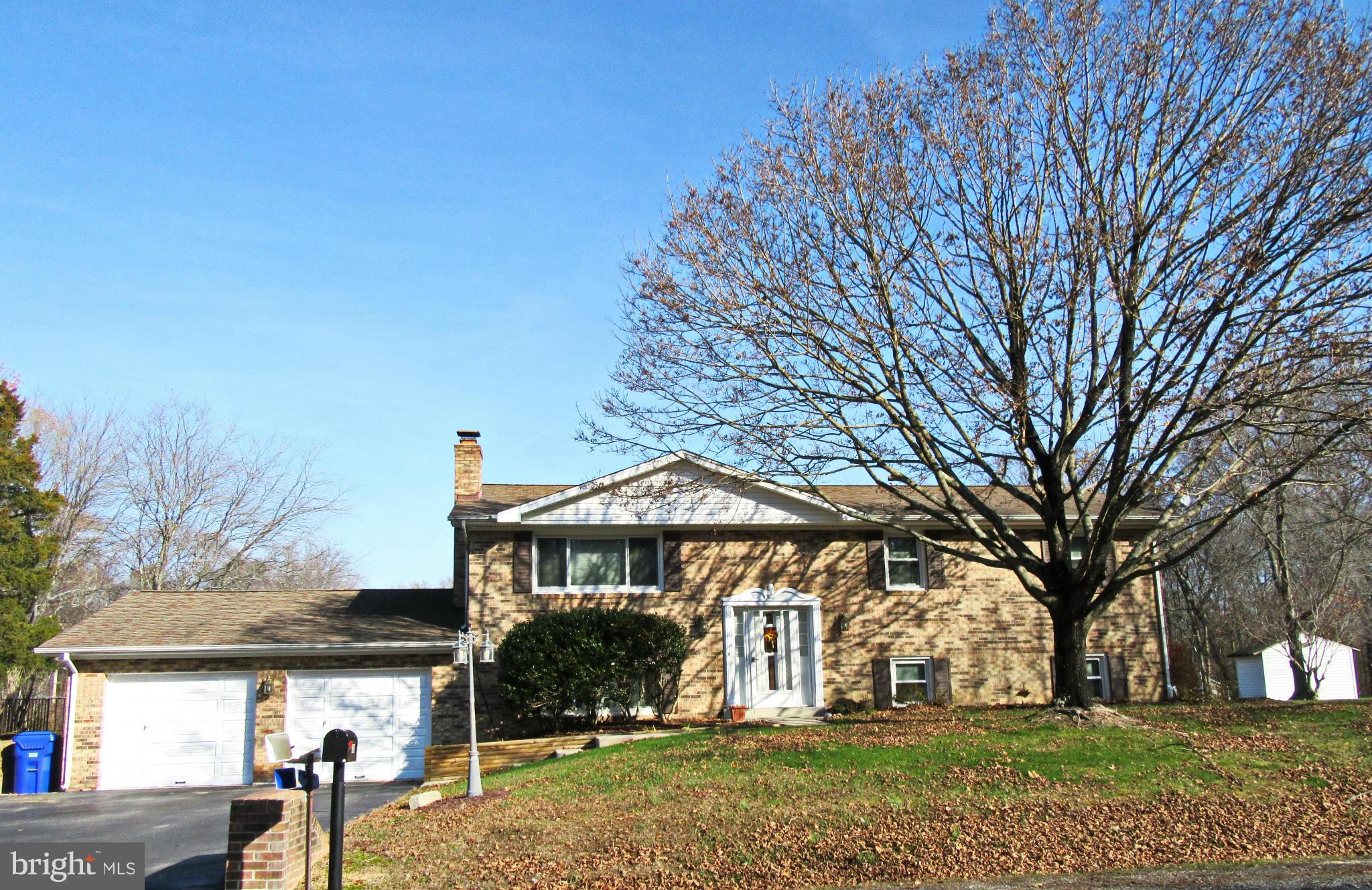 Location Location Location!..Big Bold Beauty located on corner lot. Will surely grab your buyers..from the brick front, oversized 2 car garage and a deck back yard to die for! Good sized bedrooms, hardwood under carpets, 2 sheds. No HOA! This one will go fast...priced to sell!!