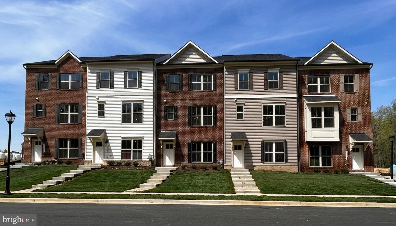 Welcome to the Magothy floorplan at 16605 Breezeway Alley, located in Caruso Homes' Manning Square townhome community in Accokeek, Maryland. This home provides an ideal blend of modern style and everyday functionality. A 2-car rear-load garage provides convenient access, while the open-concept main level creates a spacious environment ideal for both relaxing and entertaining. The great room features a built-in electric fireplace and features direct access to the expansive outdoor deck. The great room flows into the kitchen, which showcases upgraded stone countertops, upgraded stainless steel appliances, and a large center island. Upgraded hardwood flooring and elegant oak stairs add a refined touch throughout the home.

Upstairs, the primary suite offers a private retreat with an upgraded deluxe bath featuring a freestanding soaking tub. Two additional bedrooms, a full bathroom, and a convenient laundry area complete the upper level. The lower level includes an additional upgraded full bathroom. Oak starts and rails add an additional refined touch.

With energy-efficient features throughout and the assurance of a comprehensive builder warranty, this home offers exceptional comfort and value in Manning Square Towns.  Photos of similar home are for representation only and may show options or upgrades not included in this home. Contact Caruso Homes for more information or a complete list of included features.
