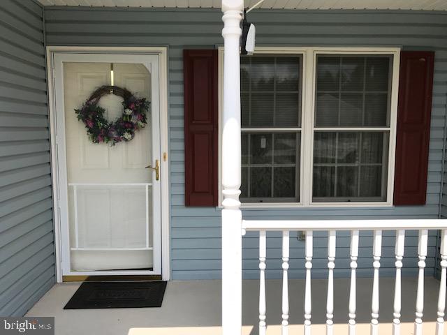 Feel at home in this beautiful, clean 50+ condo in Roth's Farm Village in Spring Grove. Low monthly condo fee of $110 includes all yard and building maintenance, snow removal and use of the community building which is close to this unit! Open concept living combines kitchen/living room and dining rooms to make entertaining family and friends a pleasure! This home has 2 bedrooms, 1 full bath with step in shower and first floor laundry room. One car attached garage with remote access, additional parking in a nearby lot.  The community is in the heart of Spring Grove, between Hanover and York. It's close to shopping, the library, restaurants, the Trolley Trail (a flat 2-mile stretch of the York County Parks Rail Trail) and Windy Hill Senior Center (which is on the other side of Roth's Church Road)