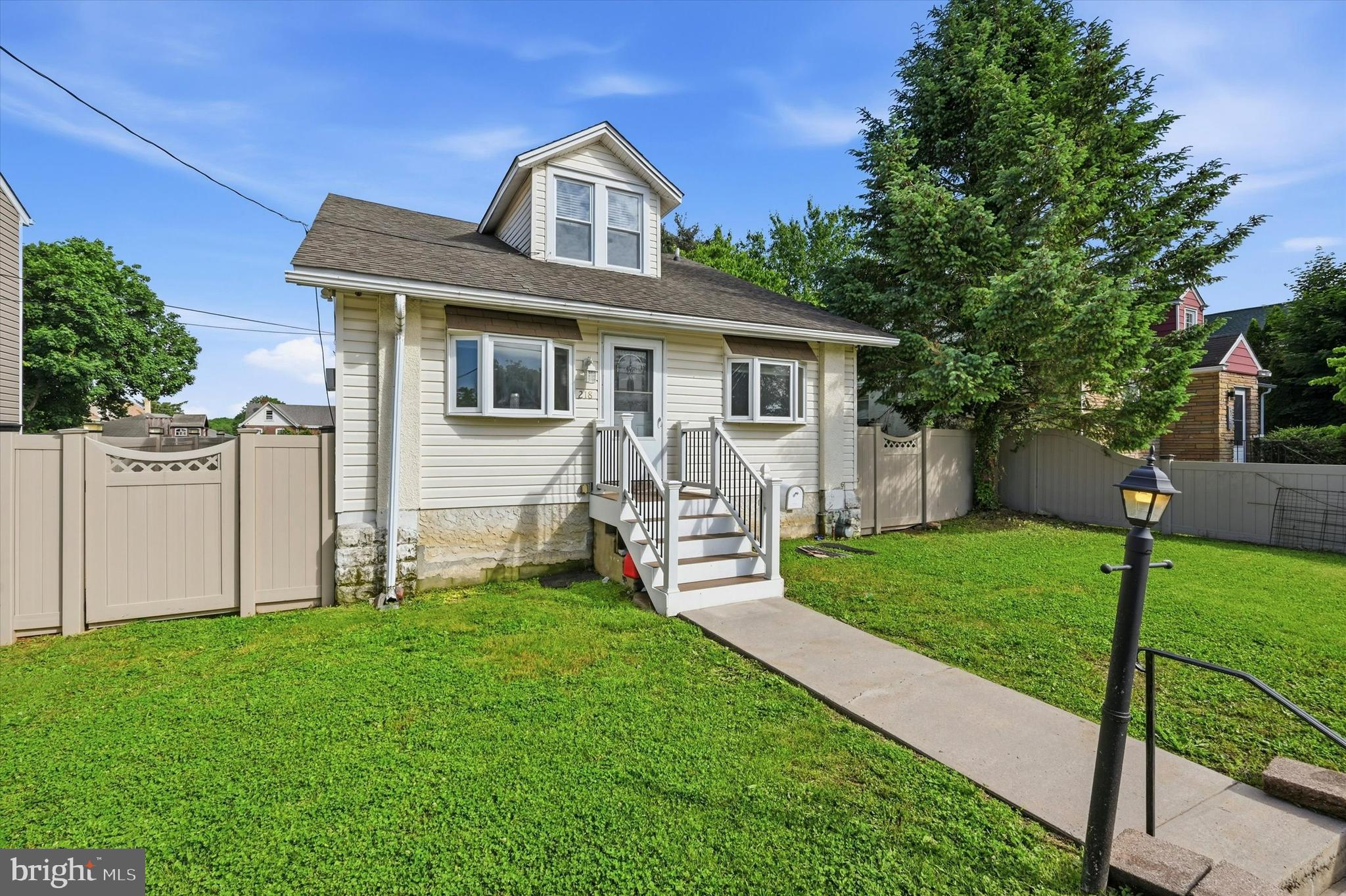 Welcome to 218 N Sylvania Ave in the tight-knit community of Rockledge! This 5-bedroom Cape Cod checks the boxes that are hardest to find together — flexible space, a private pool, and a location that makes daily living easy. Freshly refinished hardwood floors set the tone in the open concept living and dining room, which give way to the well-equipped kitchen that offers plenty of cabinet space and gas cooking.  Two large bedrooms and a full bathroom on the first floor make this layout ideal for every stage of life. Upstairs, three additional rooms offer flexibility, additional bedroom space, home office possibilities and more...plus a second full bath with a custom tile shower! Outside, you can enjoy the hot summer days relaxing by your heated above-ground pool on the worry-free Trex deck. The private, fenced yard is great for kids and pets to enjoy year-round, and for the green thumb of the family to create a gardener's paradise. Two large storage sheds provide space for all your tools and toys, and back inside a full unfinished basement houses the laundry facilities and over 800sqft of storage space! Commuters will appreciate being less than a mile from Fox Chase train station with direct service into Center City. Families will love the Abington School District — including McKinley Elementary School just five minutes away and Abington High School, a nationally recognized Blue Ribbon school.  This home truly has it all!