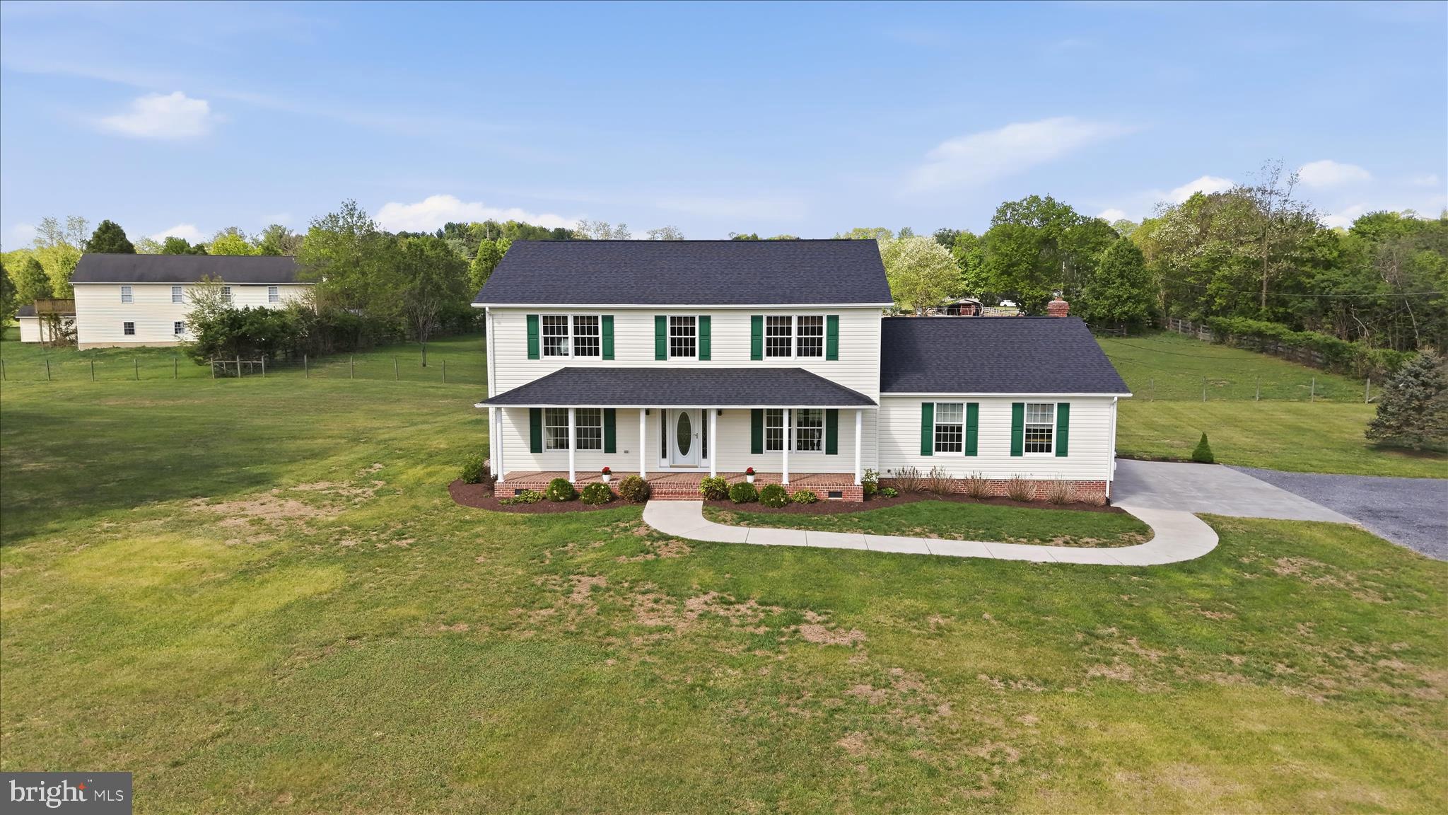Welcome home to 412 Ruebuck Road in Clear Brook, VA.  With only 2 previous owners, this custom built home is well cared for and spacious.  Recent updates include a new roof (2025), new washer and dryer with 5 year extended warranties (2025), and a new water heater (2024).  

The main level flows openly between the family room and eat in kitchen.  The formal dining room and downstairs bedroom offer style and comfort or can easily transition to office space, play room, craft area, or home schooling classroom.   The main level also includes a full bathroom, laundry/utility room, and access to the attached 1 car garage. 

Upstairs features a spacious primary suite with walk in closet and full bath, 2 additional bedrooms and another full bath.  The wide center hall landing has room for a cozy reading nook too. 

Outside relax on the 2 roofed porches.  Enjoy the uninterrupted view of fields and woods from the the front porch.   The expansive, level acreage is fenced and gated.  Allow your children and pets to roam free and play yet remain safe on your property.   The property is zoned rural/agricultural, with no HOA and horses are allowed per the covenants.   Use the 20' x 40' detached garage to house up to 4 additional cars, store equipment, or convert into a stable.   

Jump on I-81, Route 11, Welltown Pike, or Apple Pie Ridge Road for quick commutes to work, school, or shopping.  The property is only 10 minutes from Winchester and 15 minutes from Martinsburg. 

This home has been meticulously prepared for market.    Schedule your private tour today!   This property will not disappoint!!!