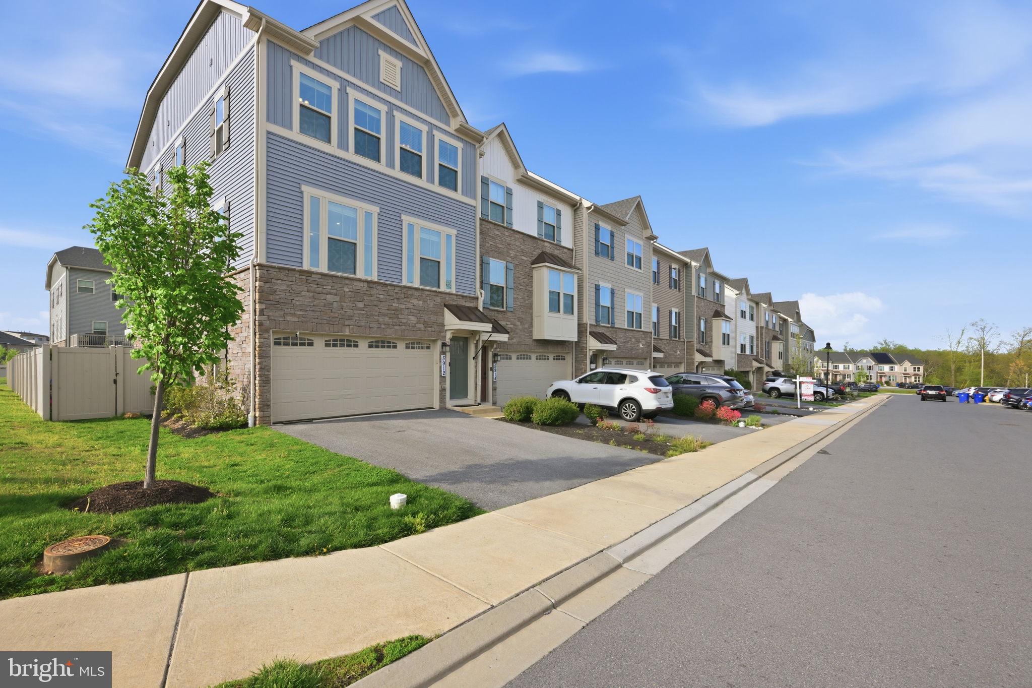 One of the Best Values in the Neighborhood!

Welcome to 5912 Pecking Stone Street, an exceptional end-unit townhouse loaded with premium upgrades, extra living space, and one of the largest yards in the community.

Offering 3 bedrooms, 3 full bathrooms, and 1 half bath, this beautifully maintained home stands out from the competition with features rarely found at this price point. The fully finished lower level includes an additional full bathroom, providing flexible space for guests, recreation, or a home office.

The gourmet kitchen is a true centerpiece, featuring a deluxe kitchen package with custom upgraded cabinetry, granite countertops, designer backsplash, stainless steel appliances, and a double oven, perfect for both everyday living and entertaining.

Throughout the home, you'll find luxury vinyl plank flooring, fresh paint, recessed lighting, and elegant tray ceilings that add architectural character. The spacious primary suite features a tray ceiling, walk-in closet, and a beautifully upgraded en-suite bath enhanced with stylish barn doors, dual vanities, a soaking tub, and a separate walk-in shower.

As a desirable corner end unit, the property offers an expansive fenced yard, private patio, and deck—providing significantly more outdoor living space than many neighboring homes. Additional highlights include a fully finished 2-car garage with upgraded flooring and walls, upper-level laundry, and an EV charger for modern convenience.

Located in the highly sought-after Lake Linganore community, residents enjoy access to resort-style amenities including pools, beaches, lake access, walking trails, playgrounds, picnic areas, and dog parks.

With its upgraded kitchen, extra full bath, premium finishes, oversized yard, and end-unit location, this home represents one of the best values available in the neighborhood. Don't miss this opportunity to enjoy comfort, style, and an unmatched community lifestyle.