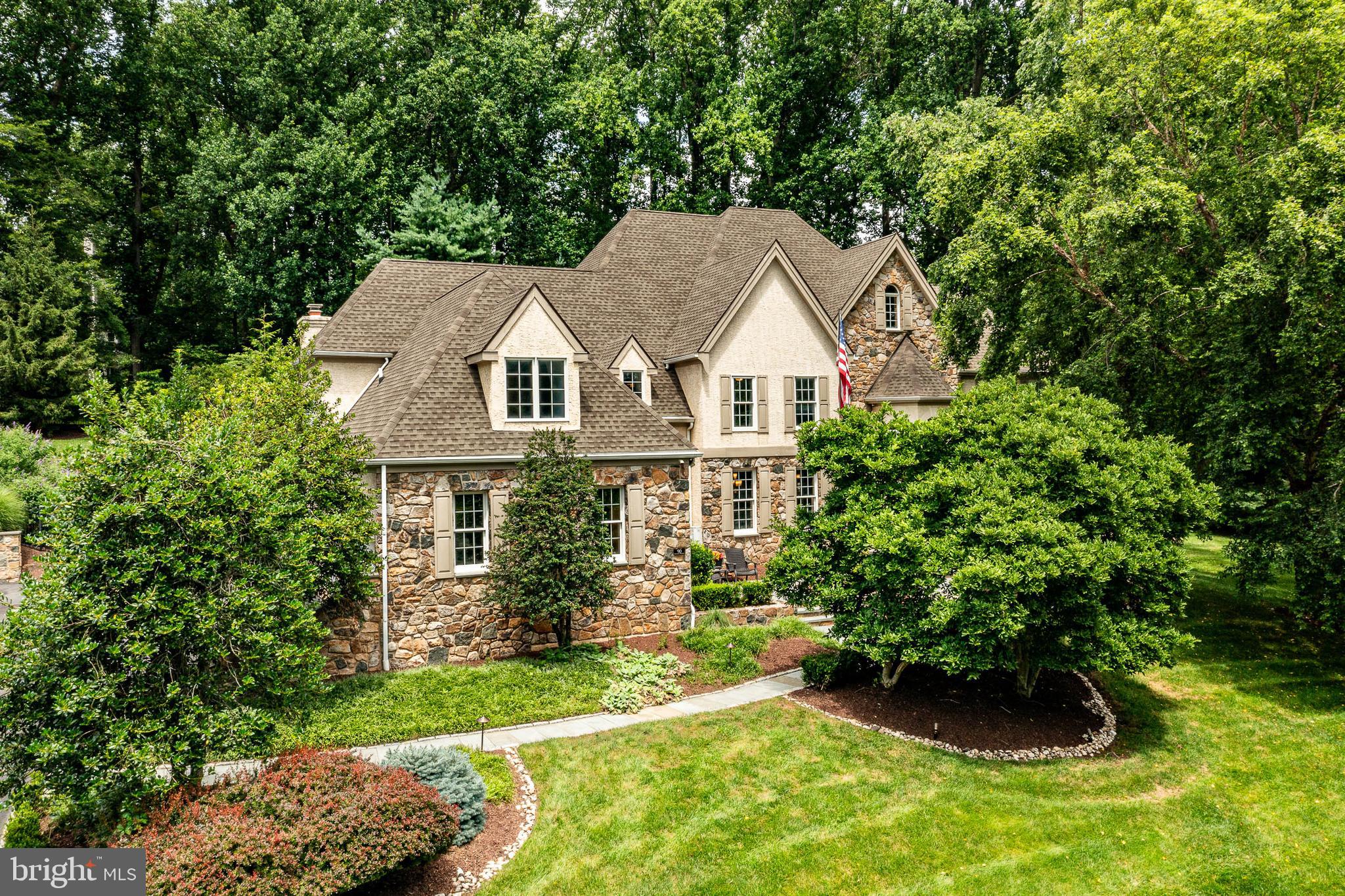 Welcome to 90 Indian Spring Road – your private summer sanctuary in the heart of Media’s highly desirable Indian Spring community!  Tucked away at the end of a peaceful cul-de-sac, this stunning 5-bedroom, 4 full and 2 half bath custom-built Colonial offers luxurious living and exceptional entertaining space on a beautifully landscaped 1-acre lot—complete with public water, public sewer, and a gorgeous in-ground heated pool.  Step inside the two-story center hall foyer and you'll be greeted by timeless elegance and modern updates throughout. The sunken living room with gleaming hardwood floors and a cozy gas fireplace creates an inviting space for gatherings, while the light-filled home office is framed by large windows offering serene views. The formal dining room features classic crown molding and wainscoting, perfect for hosting special occasions.  The gourmet kitchen is a chef’s dream, showcasing custom cherry cabinetry, a large center island,  Viking stainless appliances, double ovens, a Sub-Zero refrigerator, and a  butler’s pantry with extra cabinetry, prep sink, and floor-to-ceiling Sub-Zero wine fridge.  Adjacent is a bright breakfast area and built-in workstation, with access to the expansive Trex deck—ideal for indoor/outdoor entertaining.  The spacious family room boasts a vaulted ceiling, hardwood floors, dramatic window design, gas fireplace, and French doors leading to the deck.  The luxurious primary suite offers a peaceful retreat with a sitting area, dual California Closets, and an updated en-suite bath featuring a double vanity, jetted soaking tub, and oversized tiled shower. Four additional bedrooms include two updated hall baths with high-end finishes.  A separate back hallway provides access to a private bedroom suite with its own full bath—perfect for guests, in-laws, or an au pair.  The finished walk-out lower level includes a sixth bedroom, full bath, multiple recreation areas for media, games, or fitness, and an additional butler’s area—ideal for poolside entertaining.  Outside, the professionally landscaped fully fenced backyard is a true oasis, with stone walkways, a spacious deck and lush surroundings. A 4-car garage, walk-up attic,  whole house generator and countless custom details complete this exceptional home.  Enjoy the award-winning Rose Tree Media School District proximity to top private schools, and quick access to Newtown Square, downtown Media’s restaurants and events, and major routes including 476, I-95, and the Philadelphia Airport. This exceptional property is the perfect blend of comfort, elegance, and functionality—schedule your private tour today!