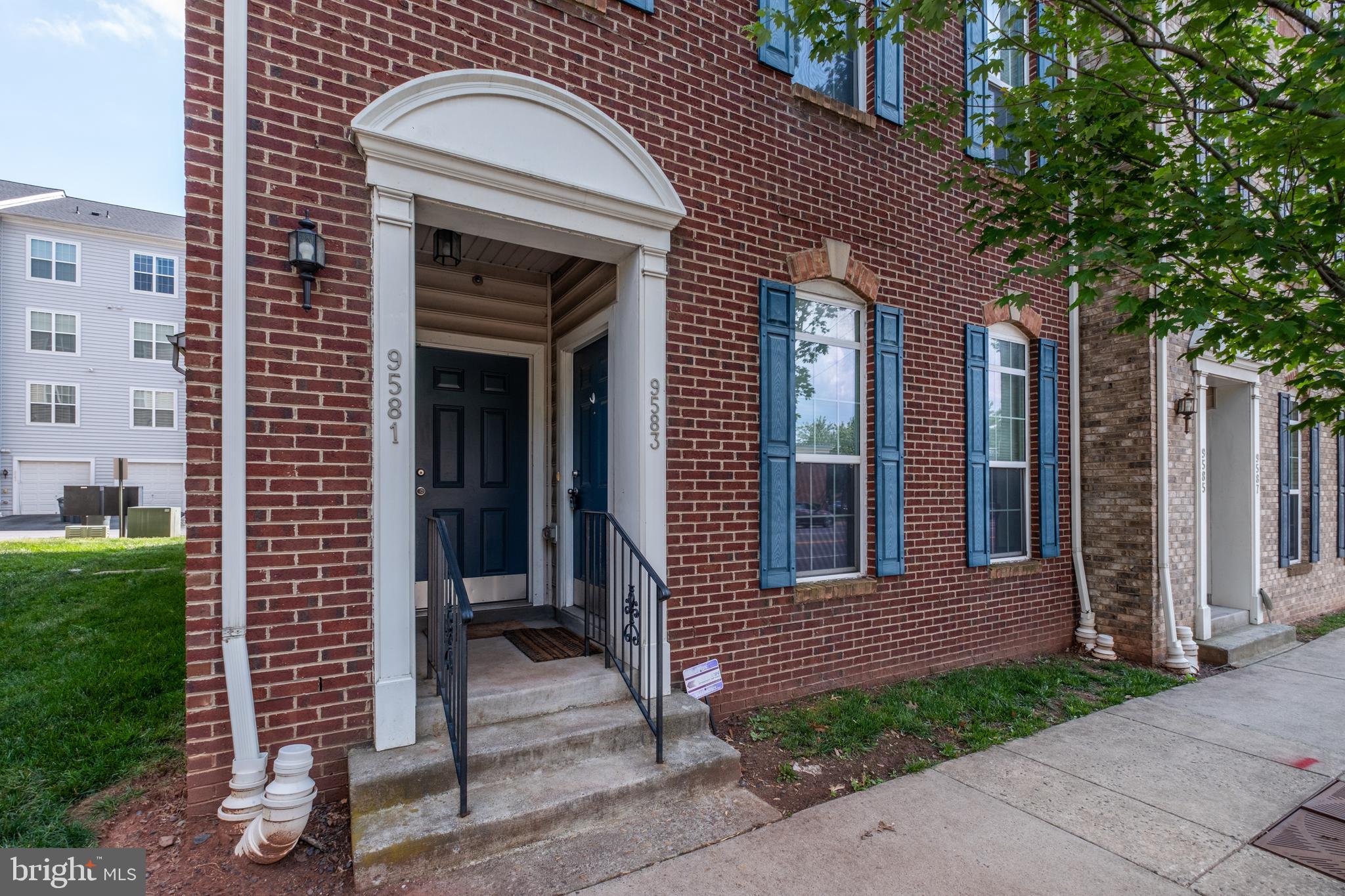DON'T BUY THIS CONDO unless you want ultimate convenience with this 3 bedroom, 2-1/2 bathroom end-unit garage condo, located WITHIN walking distance of the Manassas VRE station, bus stops, and Old Town Manassas!  This home has approximately 1800 SF of well-planned living space, with 9’ ceilings throughout the home and large windows to bring in lots of natural light.  The open-concept main level has a chef’s kitchen with granite countertops, stainless steel GE Profile appliances, and a large island overlooking the spacious living room.  The front  entrance leads you out to Center St and a short walk into Old Town Manassas, while the back of this home has a one-car garage and off-street driveway parking.

On the upper level the large, freshly painted (June 2025) primary bedroom suite has two walk-in closets and an attached private bathroom with walk-in shower.  Two additional upstairs bedrooms share the full hall bathroom.  The laundry machines are on the upper level for extra convenience.  Best of all, you don’t have to do any exterior maintenance or yard work here because the condo association takes care of that for you, plus providing water and sewer service, trash and recycling pickup, and more.

This lovely home is conveniently located to enjoy the best that historic and charming Old Town Manassas has to offer, including a vibrant restaurant and shopping scene. Get outdoors at nearby Lee Square Park, or stroll down to Baldwin Park, which is also home to the Manassas Museum. Be sure to check out the       Historic Manassas Farmers Market on Thursdays and Saturdays, too! Local wineries and breweries are also very popular. You’ll be close to highly rated UVA/NOVANT hospital for ease-of-mind. Commuters will  appreciate being a short walk from the Manassas VRE station and nearby bus stops plus quick access to    Rt 28, Rt 234 and I-66.