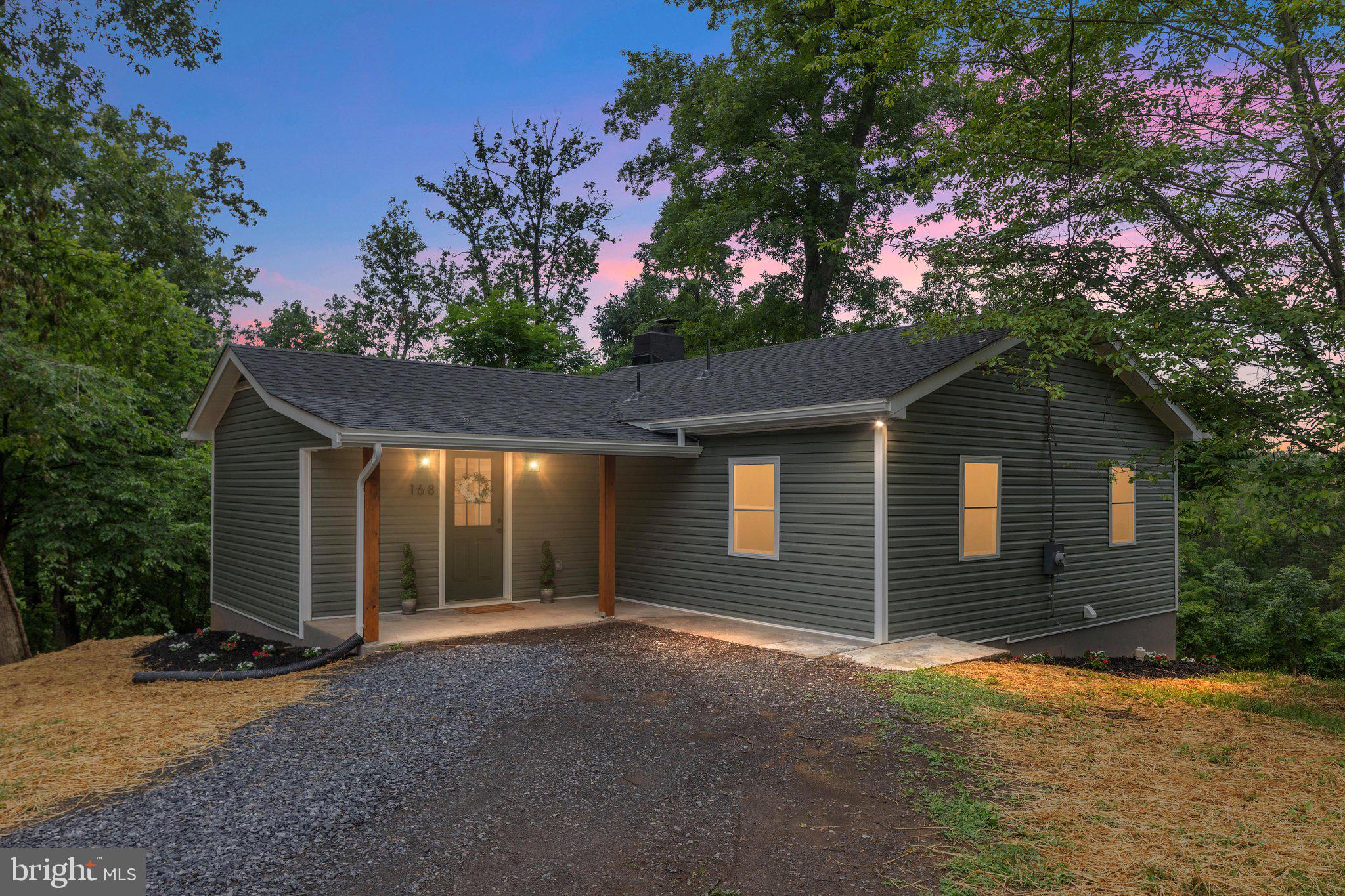 Tucked away on 1.1 private acres just minutes from downtown Front Royal, this beautifully renovated home offers the rare combination of complete privacy, modern finishes, and everyday convenience. Surrounded by mature trees and overlooking peaceful fenced pasture views, it's the kind of property that invites you to slow down, relax, and enjoy the beauty of the Shenandoah Valley.

Completely renovated from the studs with exceptional attention to detail, this 2-bedroom, 2-bath home is truly move-in ready. No corners were cut during the renovation, offering peace of mind with quality craftsmanship and thoughtful upgrades throughout. The bright, open kitchen serves as the heart of the home, featuring beautiful finishes that make cooking, entertaining, and gathering with family and friends effortless.

The spacious living areas flow naturally to a large rear deck where you'll enjoy morning coffee overlooking the tree line or evenings watching the sunset across the neighboring pasture. The expansive yard provides endless opportunities for children to play, pets to roam, gardening, outdoor entertaining, or simply enjoying the privacy that is becoming increasingly difficult to find.

The partially finished basement with a full bathroom offers flexible space for a recreation room, home office, guest suite, workout area, or future expansion. Outside, the detached one-car garage includes additional storage or workshop space, while the oversized driveway provides plenty of room for guests, recreational vehicles, or multiple vehicles.

Despite its peaceful setting, you're only minutes from downtown Front Royal's restaurants, local shops, wineries, breweries, outdoor recreation, and convenient access to major commuter routes.

If you've been searching for a turnkey home where you can enjoy modern living, privacy, and the natural beauty of the Shenandoah Valley without sacrificing convenience, 168 Dungadin Road is a property you won't want to miss.