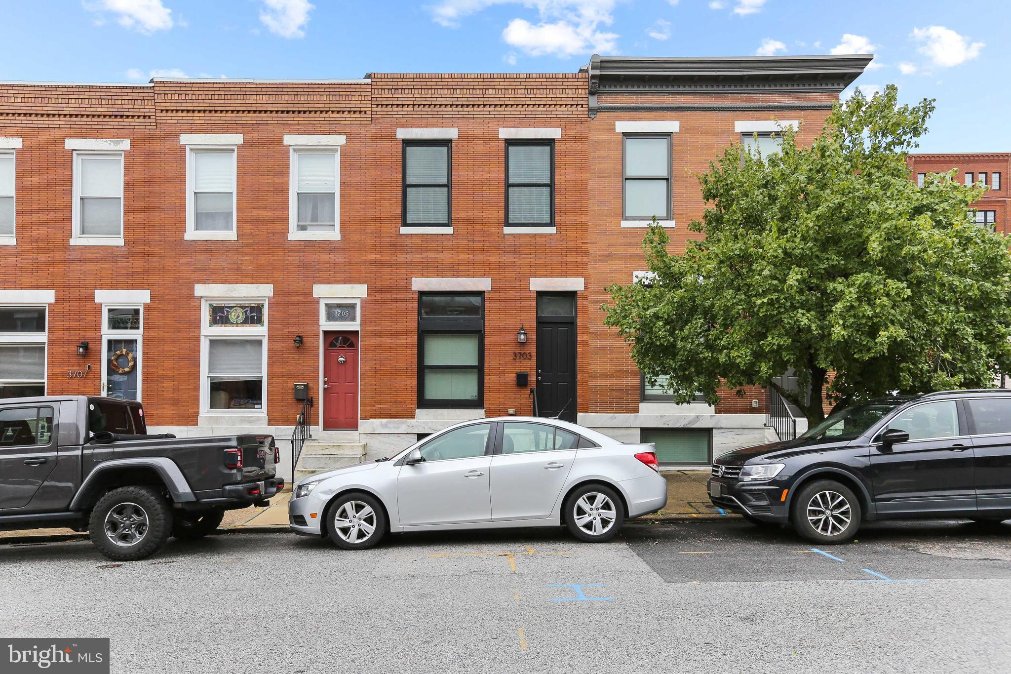 CHAP TAX CREDIT RENOVATION W/ PARKING & ROOF TOP DECK - this 14' wide renovation  in convenient Brewer's Hill location features an open floor plan w/ hardwood floors throughout, island kitchen w/ granite counters, custom cabinetry, ss appliances, crown molding and exposed brick.  Upper level offers large owner suite w/ luxurious bath, hallway laundry & second full bath, rear bedroom w/ walk in closet leading to two tier roof top deck.  There is a fully finished lower level with two additional bedrooms and walk out basement.  Approximately 4 years remaining on chap tax credit - current taxes only $3253/year with credit!