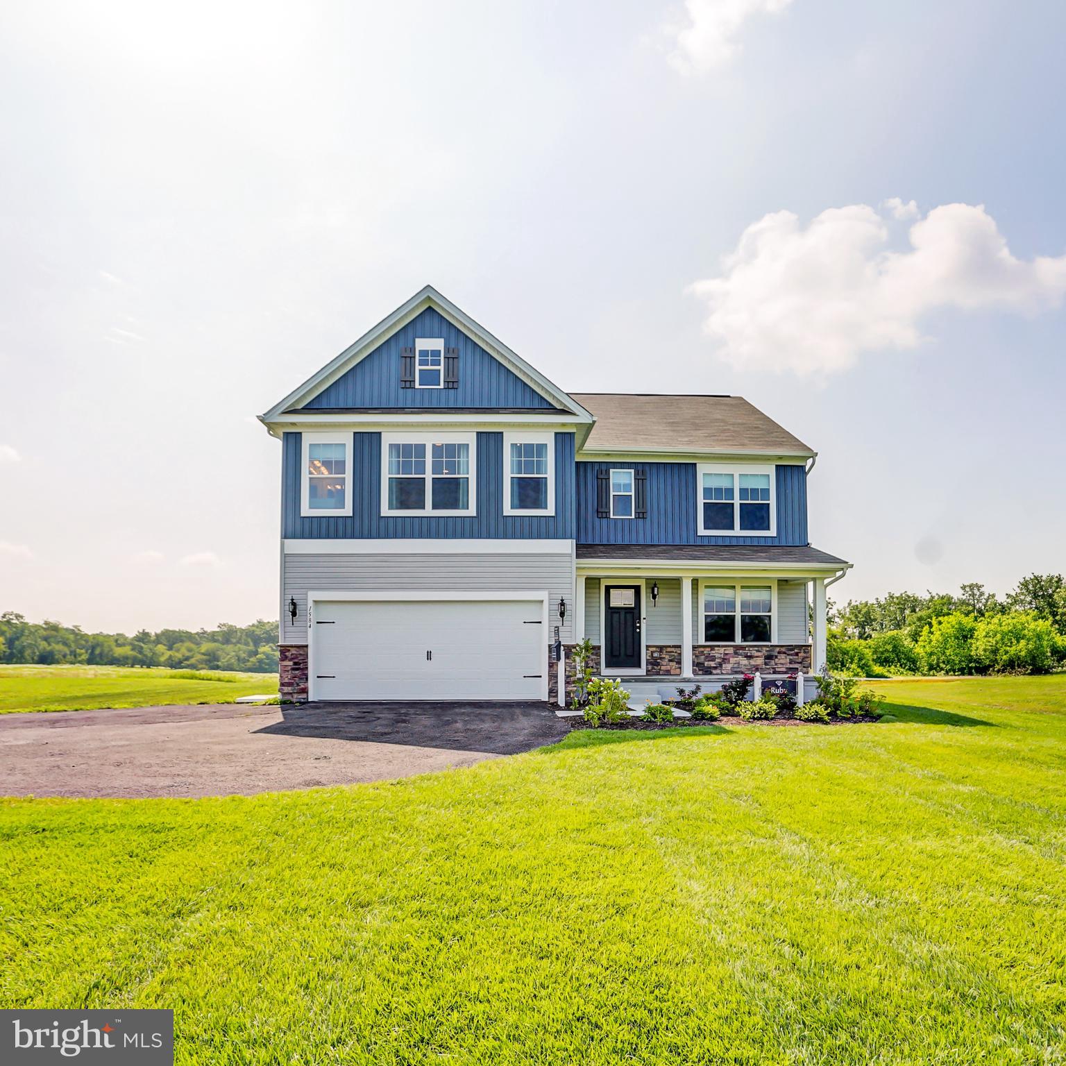 MODEL HOME FOR SALE!!! THIS BEAUTIUL RUBY FLOOR PLAN OFFERS 4 BEDROOMS, 3.5 BATHS, 2 CAR GARAGE AND A FULL, FINISHED BASEMENT! ADDITIONAL UPGRADED FEATURES INCLUDE A WALK UP, EXPOSED BASEMENT, FIREPLACE, GRANITE COUNTERTOPS WITH A KITCHEN ISLAND, AND A 12X12 DECK! DON'T MISS YOUR OPPORTUNITY TO OWN THIS HOME IN BEAUTIFUL CHAMBERSBURG, CONVENIENTLY LOCATED CLOSED TO INTERSTATE 81, SHOPPING, DINING, AND SEVERAL OTHER AMENITIES.
As you walk in the first floor is an expansive, open floorplan of the Choice Room, Great Room, Breakfast Nook, and kitchen. The openness of these areas offers plenty of space and ease for informal dining and entertaining. The Kitchen has a tremendous amount of space, plenty of cabinets, and a deep pantry, making storage plentiful and organization easy. 
As you climb up the stairs to the second floor you find a generous Owner's Suite with a walk-in closet and a private bathroom with a large shower, double vanity, and private water closet. The Owner's Suite shares the level with three additional bedrooms, a laundry room, a full hall bath, and a large loft area.