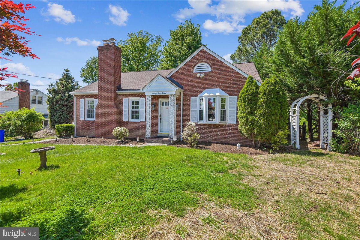 This spacious Cape Cod  on a quiet cul-de-sac in desirable Perry Hall has storybook charm!  Just minutes from shopping, restaurants, and everyday conveniences.  Hardwood floors and a wood-burning fireplace highlight the living room, while the separate dining room is perfect for entertaining.  The eat-in kitchen features gas cooking, a tile backsplash, wainscoting, and space for casual dining.  A bright sunroom with wood ceilings and walls of windows overlooks the backyard and fills the home with natural light.  The private primary suite addition has cathedral ceilings, recessed lighting, a built-in vanity, and a beautifully updated en-suite bath.  Three additional generously sized bedrooms provide plenty of space and flexibility. The finished lower level includes a cozy sitting area and a large family room with a gas fireplace and stone surround. Outside, enjoy a beautifully landscaped, fully fenced backyard complete with an in-ground pool -- ideal for relaxing or entertaining.