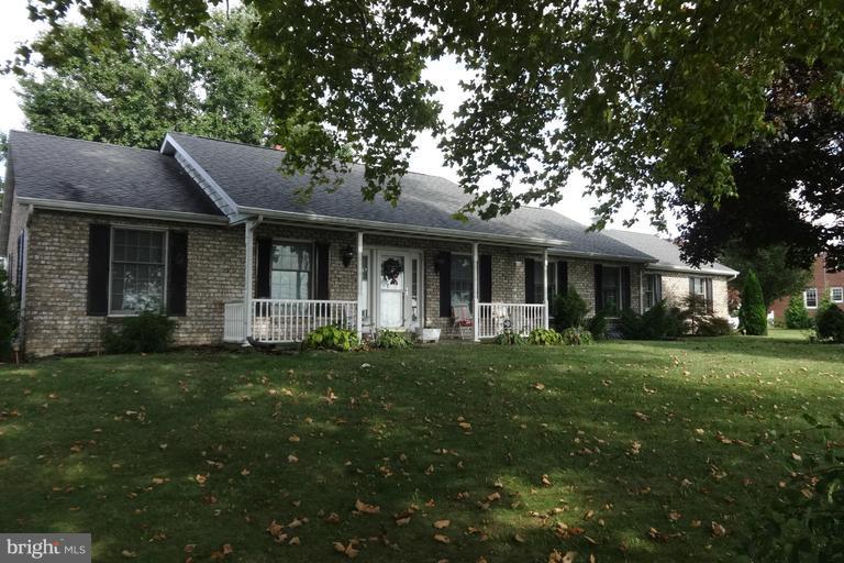 This home is zoned commercial but is currently a residence. Very well built with lots of room. Granite counter tops, remolded kitchen opening to  family room with fireplace. Property has formal living and dining rooms. Basement needs new carpet but can be configured as an in-law appt. Fantastic basement bath with soaking tub.