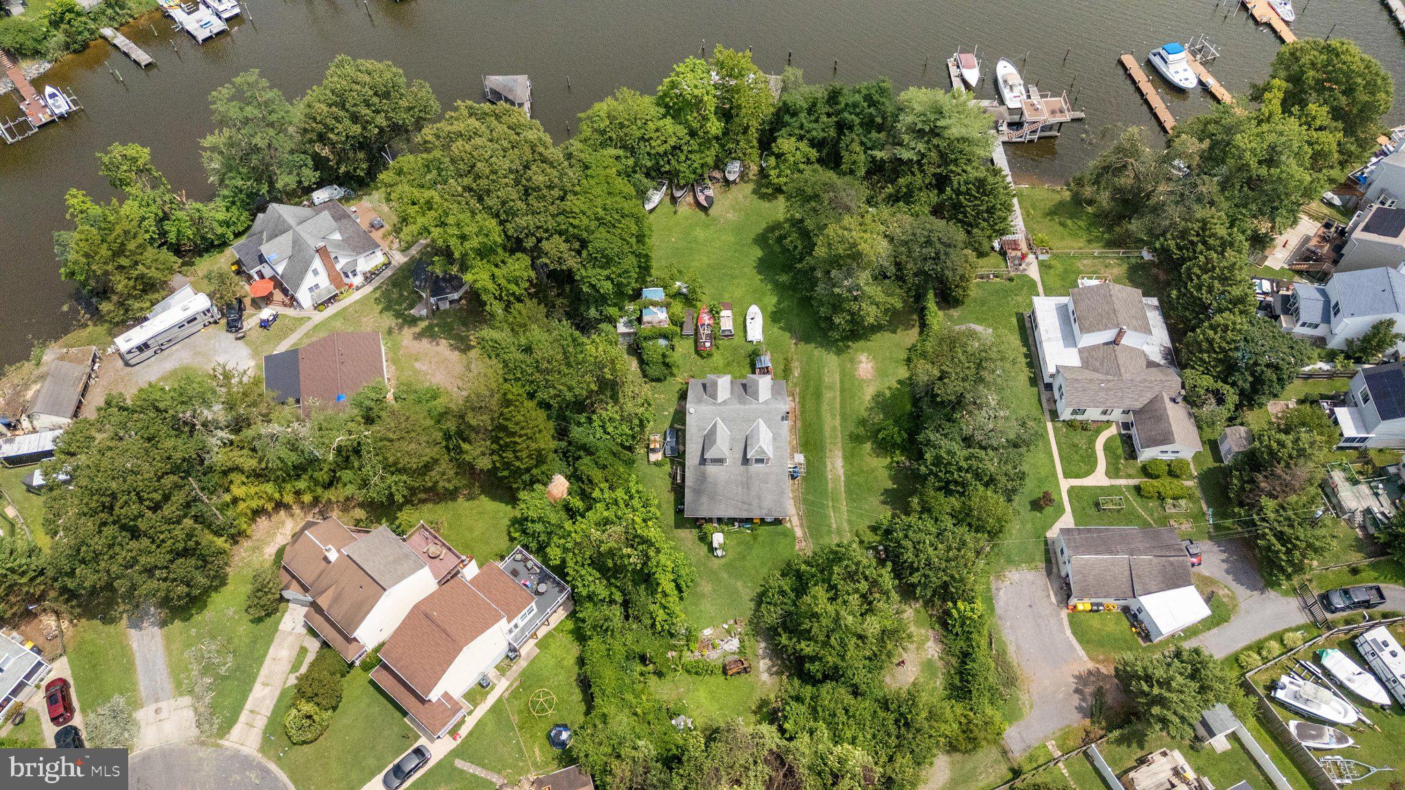 Rare waterfront opportunity in Pasadena! Situated on approximately one acre with approximately 200 feet of waterfrontage, this property offers a unique opportunity to create your own waterfront retreat or redevelopment project. The property features a private dock with boat lift, providing direct access and the perfect setting to enjoy all that waterfront living has to offer.  The existing dwelling is being sold strictly AS-IS and provides an opportunity for renovation or replacement. The true value is in the land, expansive waterfront setting, and potential this property offers.

Property features a private well and septic system. Buyer to perform their own due diligence regarding condition, permits, utilities, future use, and redevelopment possibilities. Existing boats, vehicles, and remaining personal property convey with the sale. Boats and vehicles have titles. A rare opportunity to own a large waterfront parcel in Anne Arundel County with endless possibilities.
