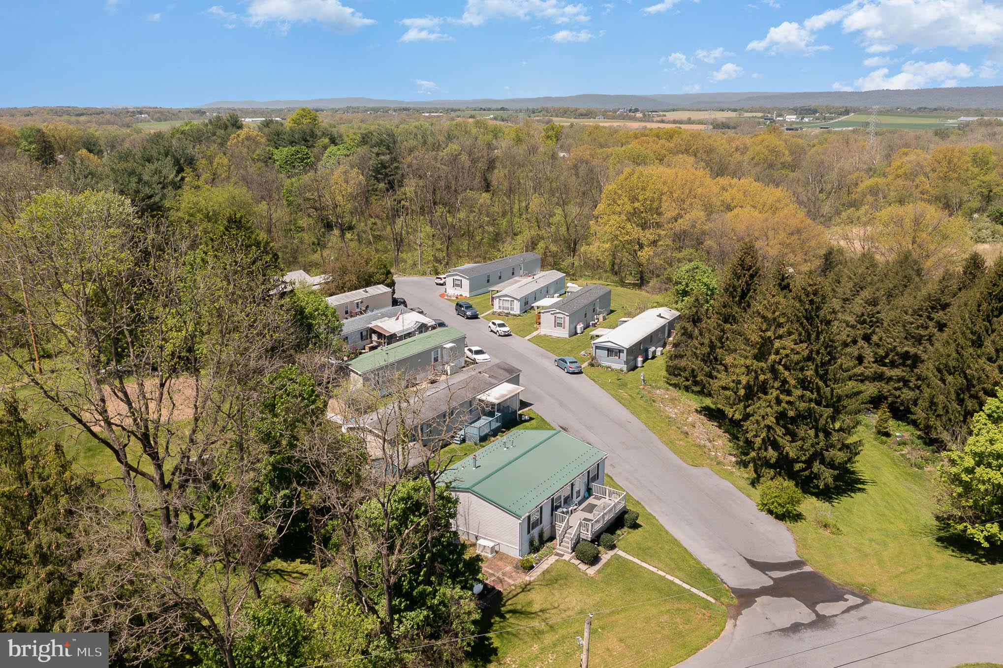Great Opportunity to have your money work for you. This Mobile home park comes ready to go with 10 out of 11 lots already rented. Owner in the last 2 years Repaved the Road, Did extensive landscaping, Redid Water Retention, and have 2 New homes into the park.