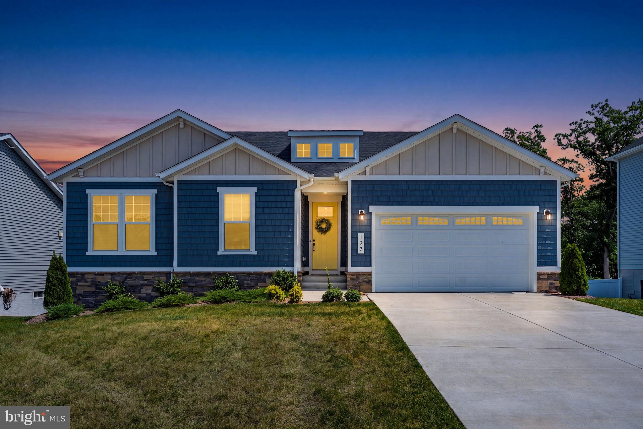 Looking for new construction without the new construction price? This stunning ranch-style retreat is only 2 years old and offers over 2,200 square feet of thoughtfully designed space, complete with 3 spacious bedrooms and 2 full bathrooms. The warm open floor plan with soaring 9' ceilings creates a bright and airy feel, and walls of windows fill the main living space with natural light.

A spacious family room with beautiful views flows seamlessly into the updated kitchen, featuring quartz countertops, stainless steel appliances, and a large center island with seating. A separate breakfast area surrounded by windows is the perfect sunny spot for your morning coffee, while glass sliders lead out to the covered rear porch, the ideal place to unwind and watch summer storms roll across the sky. Not to be missed: a mudroom with built-ins and desk area, plus an incredible walk-in pantry with custom real wood shelving.

The spacious primary suite provides a peaceful escape, complete with a spa-like bathroom featuring dual vanities, a soaking tub, a glass shower with Jolie Filtered Showerhead and sitting bench, and a generous walk-in closet. Two additional bedrooms, an oversized laundry room, and a separate full bathroom complete the main level.

The walk-out basement offers endless potential for finishing, with sliders leading to a covered patio and the private backyard. Backing to protected land along Abrams Creek, the fenced-in yard offers beautiful views, added privacy, and a tranquil setting. Welcome home to Triangle Court!