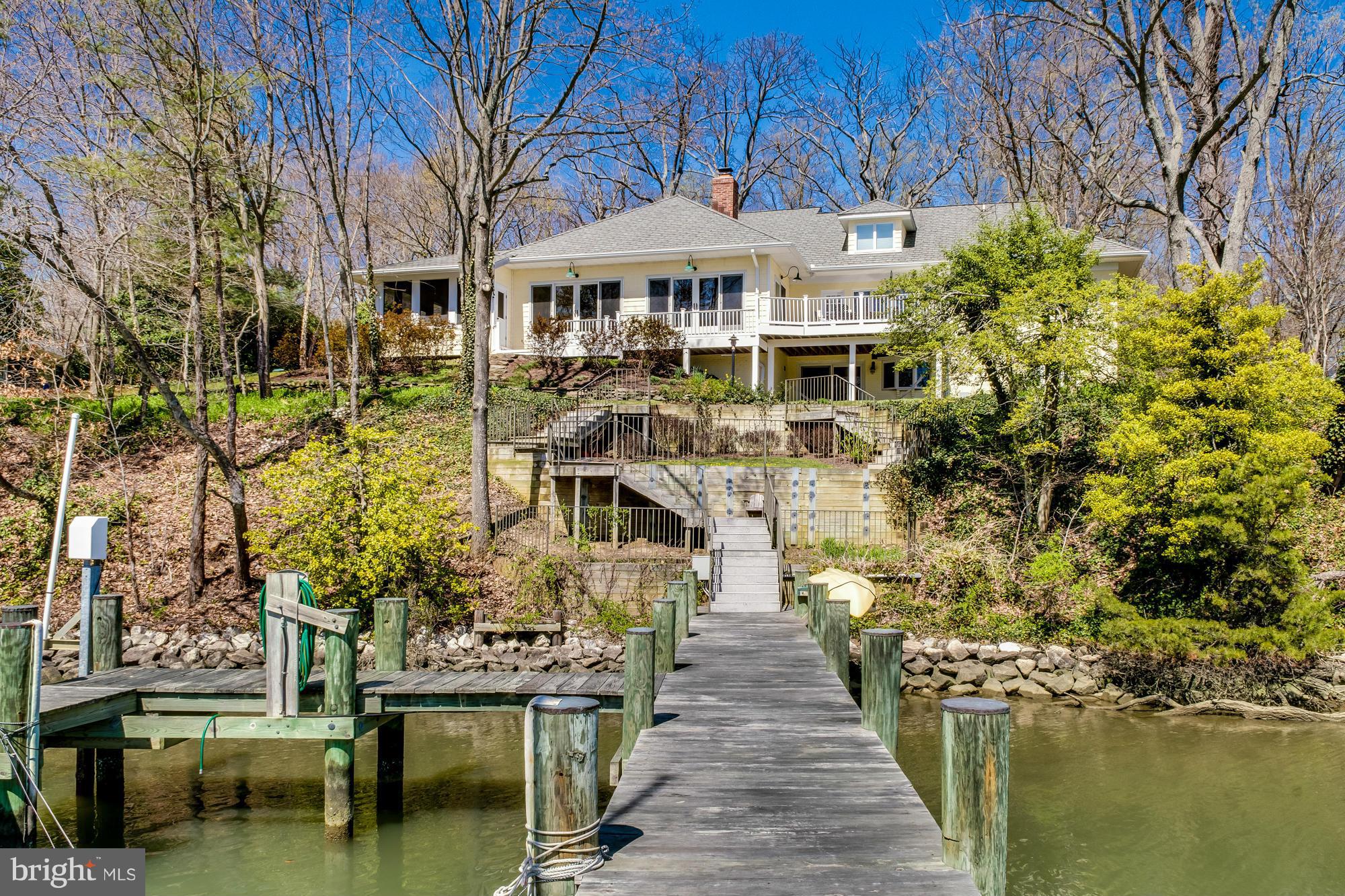 FaLocated on Lake Ogleton w/ 200 ft of waterfront w/deep water, 3 slips & boat lift. Raised ranch w/ Adirondack feel! Open floor plan w/ cathedral ceilings & wall of windows overlooking the water, hardwd floors & dual sided FP,  screened porch/sun room,kitchen features granite & SS. 4 BRs on Main Level including Master. Loft w/ office space.
