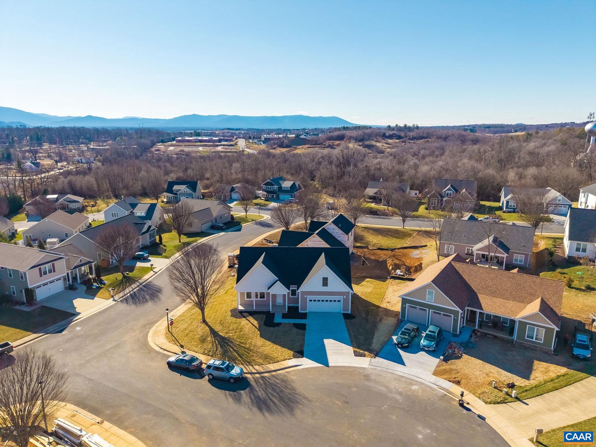 New construction in the Silver Creek subdivision, a gem tucked away in the city with nearby conveniences. Home features a corner lot at the cul-de-sac, highend craftsmanship, quality hardwood floors, colonial trim, the primary suite on the main level, and plenty of room to spread out! Meticulously crafted custom features include quality hardwood flooring throughout, Hardie plank siding, a tiled shower in the large main-level primary suite, wrought iron stair railing and a wide staircase, a pergola on the back deck, and a vaulted ceiling in the living room.  A highlight of the home is the large primary suite, located at the back of the home for privacy and tranquility. The spacious living room features a soaring ceiling and a gas-log fireplace. Three additional bedrooms and a bonus room are located on the second level, providing flexible space that can be used for a home office, play area, storage, hosting guests, or an in-law suite utilizing the adjacent hallway bathroom. The laundry/mud room is conveniently located just off the garage. There is so much to love about this beautiful home, come see it today! Property is still under construction and will be completed soon.,Granite Counter,Painted Cabinets,Fireplace in Living Room