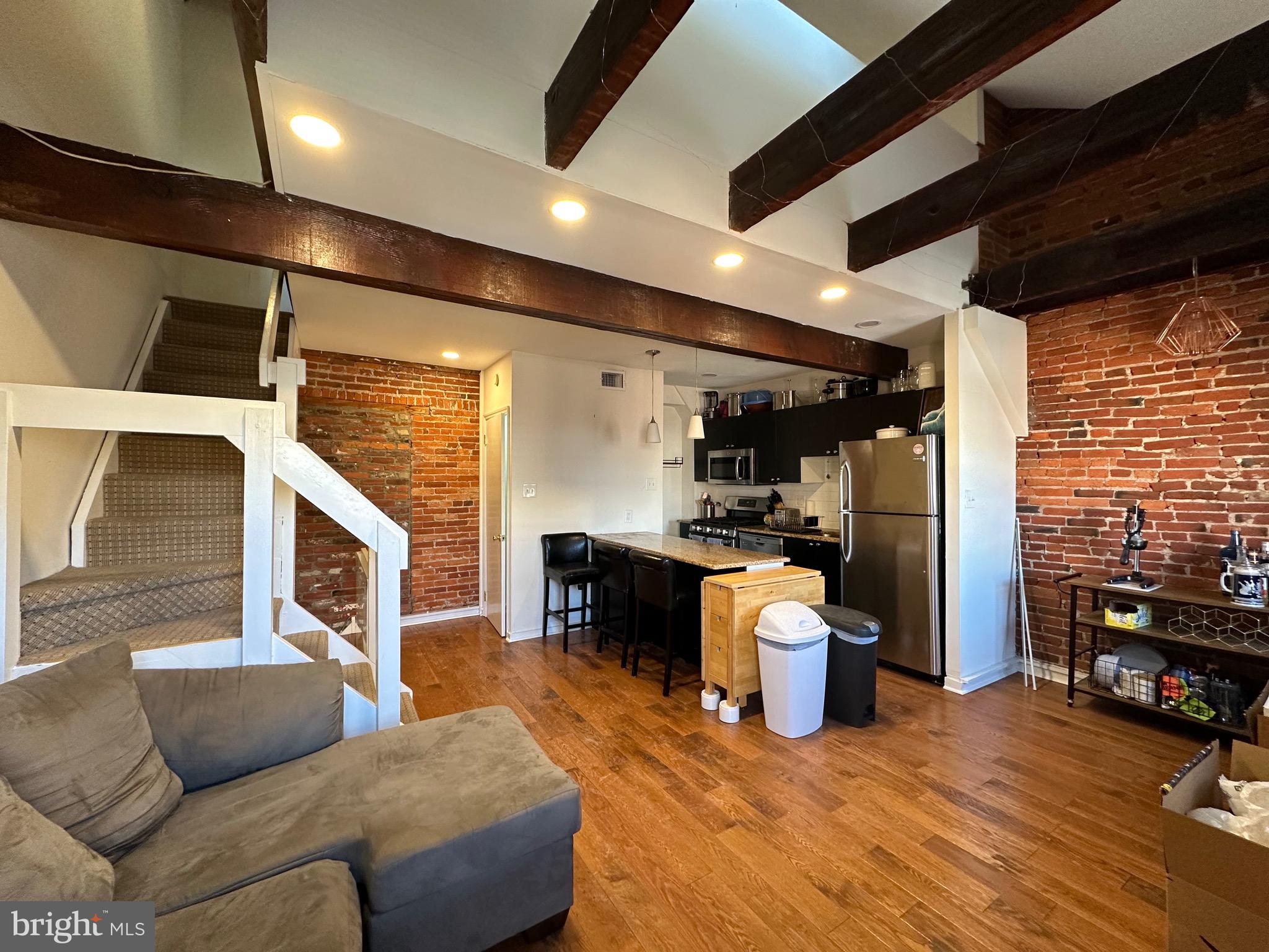 Tri-level 1 bedroom plus den in historic townhouse! The apartment has been completely renovated to combine modern amenities & historic detail. These stunning renovations include New Hardwood Floors Throughout, High Ceilings, New Central Air/Gas Heat, New Tile Bathroom with Tub & Shower, Dramatic Spacious Open Design with Exposed Brick Wall and wood beams. Stainless steal Appliances: 5 burner gas stove, dishwasher, microwave, garbage disposal, lots of cabinets and granite counter tops, Breakfast Bar for bar seating. Energy Efficient Double Pane Windows. Washer/Dryer in Unit. Lots of Closets & Storage Space. Cats welcome at no additional charge. Easy to work from home in the bonus den space! Close to Jefferson & Pennsylvania Hospitals, public transportation, I95, 76, shopping, restaurants and all that the city has to offer. Requires first month rent, last month rent & security all due upfront at lease signing.