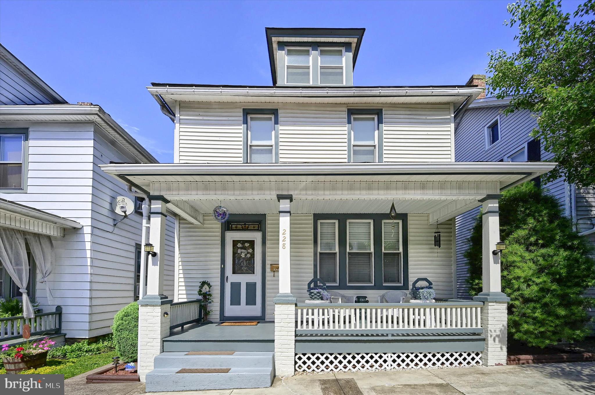 Step back in time and fall in love with this beautifully maintained early 1900s detached home in the heart of Newport Borough. Surrounded by gorgeous landscaping and brimming with character and charm, this special property offers timeless appeal both inside and out.

A welcoming front porch invites you to relax and enjoy the friendly neighborhood atmosphere. Inside, you'll immediately feel at home with decorative transom windows, abundant natural light, and warm, inviting living spaces. The cozy kitchen features a convenient breakfast bar and flows seamlessly into the formal dining room, while the spacious living room showcases large front windows that fill the home with sunlight.

Upstairs, you'll find three comfortable bedrooms and a generously sized full bath. A walk-up attic provides excellent storage space, while the clean basement includes  a laundry area and an attached workshop/shed area with walkout access to the lower deck and backyard.

Outdoor living is equally impressive with two rear decks—upper and lower levels—perfect for entertaining, relaxing, or taking in the beautiful mountain views. The meticulously maintained yard offers plenty of room to enjoy the outdoors, and a paved driveway provides off-street parking.

Ideally located in a welcoming borough setting, this charming home is just moments from local shops, restaurants, parks, and everything this quaint river town has to offer. A rare opportunity to own a lovingly cared-for home filled with history, character, and modern-day comfort.