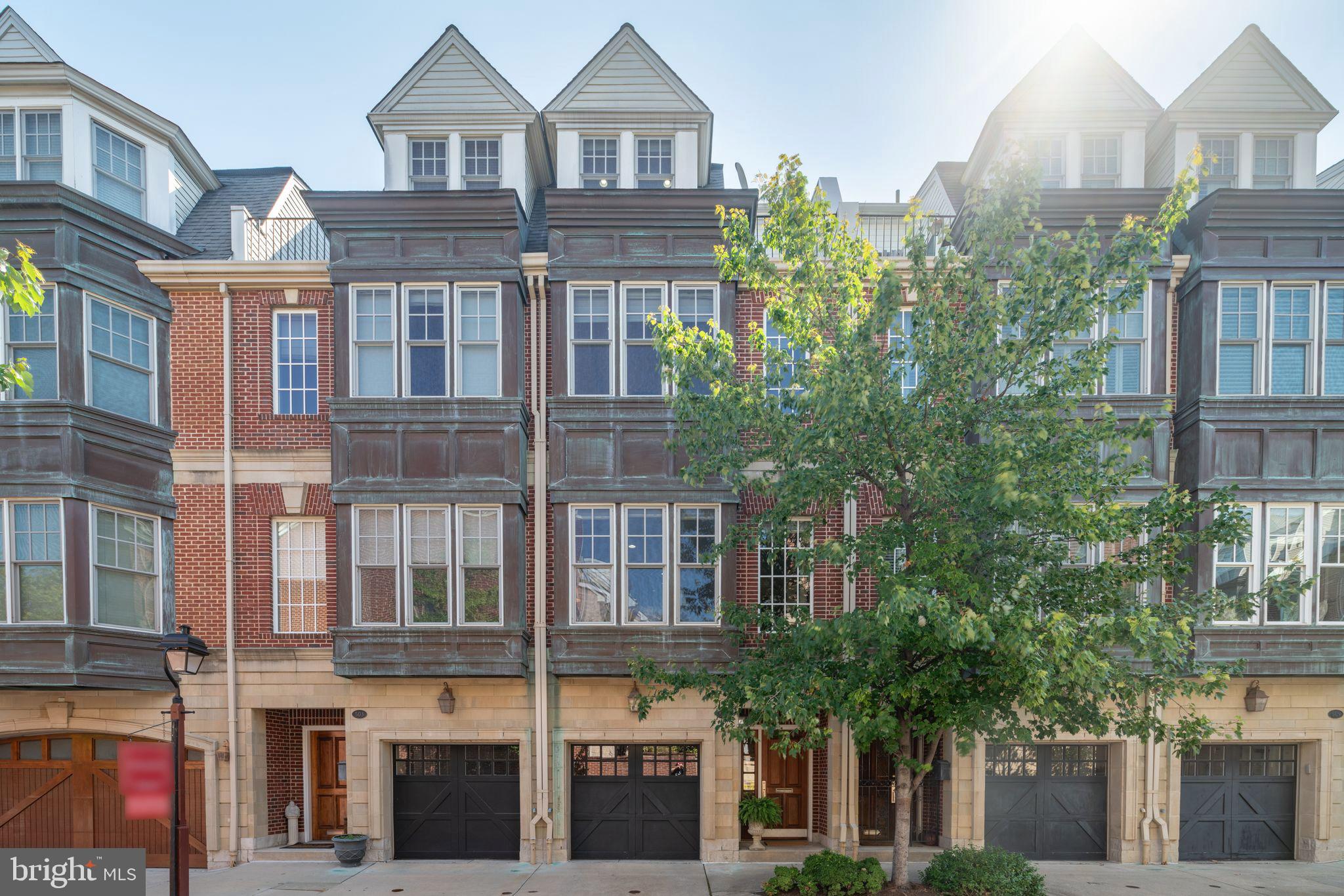 Lovely traditional 4-story townhouse located on a quiet street, near 2nd and Lombard in the historic Society Hill neighborhood. This special location is close to the weekly Head House Square Farmer's Market, a great variety of restaurants, stores and an easy walk to Washington Sq and Three Bears Park. This spacious and bright home of approximately 2,700 sq ft has 4 bedrooms, large study/family room, 3 full and 2 half baths, garden/patio and sun deck. There are high ceilings, oak hardwood floors and custom shades throughout.  The 1 car GARAGE opens directly into the home. Substantial improvements have been made throughout, especially during 2022-23. Lovely ceramic tile entry foyer, powder room and 4-stop ELEVATOR. 3 steps down to large family room with ceramic tile floor, built-in bookcases, FIREPLACE and access to charming brick patio and garden.  Several large coat and storage closets and mechanicals also on this level. Second floor has traditional LIVING ROOM/DINING ROOM with bay window, custom wall of book shelves and crown moldings. Eat-in COOK'S KITCHEN with center polished granite-topped island. Stainless steel appliances include Viking gas range and hood, Liebherr refrigerator, wine fridge, dishwasher, built-in microwave and deck with grill (included). Third floor contains the primary bedroom suite with large polished travertine bathroom. This bathroom has double sinks in travertine-topped vanity, double-sized shower with new rain head. There are 3 large closets - one custom designed and added by this owner. Full size washer/dryer and linen closet. An additional bedroom and full tiled bath with large soaking tub are also on this level. Fourth floor has 2 additional bedrooms, each with large closets, a large walk-in closet, full tiled bath and access to sun deck. 2 zone HVAC system. This pristine home has been exceptionally maintained and is in move-in condition. A wonderful combination of traditional and contemporary design.