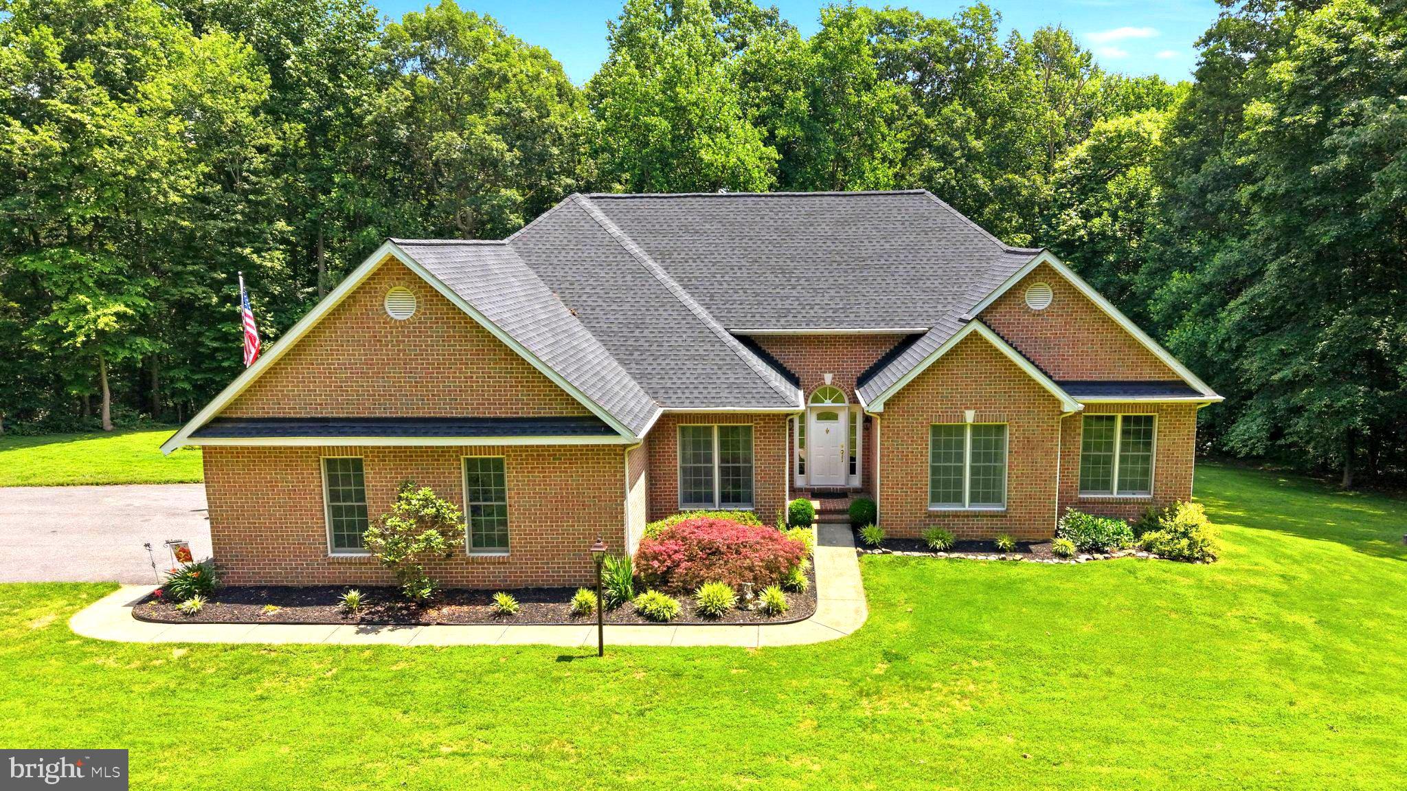 Private 3.65 acre retreat with a saltwater pool and single level living, just 15 minutes from Bel Air. Tucked away at the end of a private lane serving only four homes, this custom-built ranch with a full brick exterior offers the peace and privacy of country living with everyday convenience. Designed and built with quality and longevity in mind, the home reflects thoughtful craftsmanship, durable construction, and a level of care that is increasingly difficult to find. With over 4,200 total square feet, including nearly 2,900 finished square feet, plus substantial unfinished space, the property offers exceptional versatility for everyday living, storage, hobbies, a workshop, or future expansion.

Mature trees, open yard space, and a tranquil wooded backdrop create a setting that feels worlds away. The backyard is designed for making memories, featuring an in-ground saltwater pool with diving board and an expansive 12' x 44' Trex composite deck with plenty of room to relax, entertain, and enjoy the outdoors.

Inside, Brazilian cherry hardwood floors, fresh paint, and 9-foot ceilings create a warm and inviting atmosphere throughout the main level. The kitchen features granite countertops, abundant solid wood cabinetry, generous workspace, a dedicated pantry, and a sunny breakfast nook overlooking the backyard. The adjoining family room features an auto start pellet stove, while the separate dining room is ready for holidays, celebrations, and everyday meals. A convenient half bath, separate laundry room with utility sink, and oversized attached 2 car garage add functionality to daily living.

The main level includes 3 bedrooms, 2.5 baths, and a dedicated office that can also serve as a 4th bedroom, nursery, guest room, playroom, or additional workspace. The primary suite features a large walk-in closet and an updated bath with a jetted soaking tub, custom glass shower with dual shower heads, terrazzo shower base, double vanity, and separate water closet. Both secondary bedrooms offer large closets, and a full hall bath serves the private bedroom wing.

The finished lower level provides flexible space for movie nights, games, crafts, entertaining, fitness, or working from home. A second auto start pellet stove adds warmth, while an oversized full bath and level walkout to the backyard expand the possibilities. The unfinished portion offers abundant storage and outstanding potential for additional finished living space, including a bedroom, guest suite, hobby room, home gym, or workshop.

Lovingly maintained by its original owners, the home reflects years of thoughtful care and improvements, including a Trex composite deck in 2021, a new roof in 2022 with transferable 20 year workmanship and 50 year shingle warranties, gutter guards, and a new pool liner, safety cover, and solar cover in 2023. A new pool pump and vacuum were added in 2026.

Whether entertaining poolside, enjoying morning coffee on the deck with the hummingbirds, watching a summer storm roll through the trees, or spending a cozy evening by the fire, this is a home designed to be enjoyed in every season.