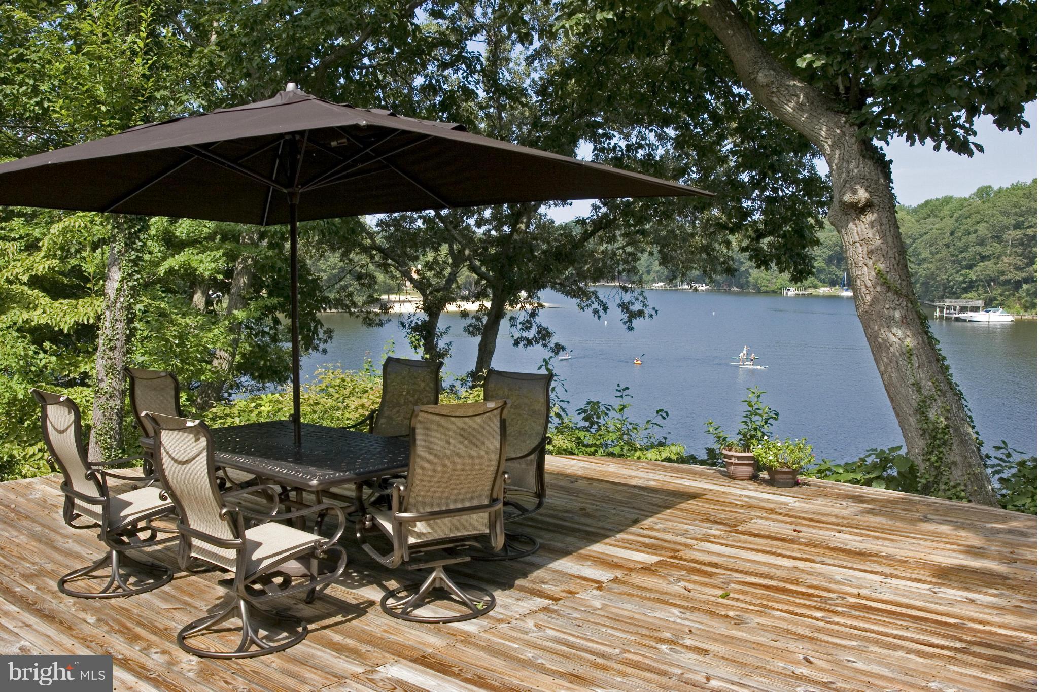 This is it....If you are looking for a home with  incredible views a dock and a great location,  look no further.  Spacious deck, beautiful gazebo, and a  awesome quest house with full bath as well, recently replaced roof, skylights, resurfaced dock, and updated kitchen.  Did I mention the fireplace.