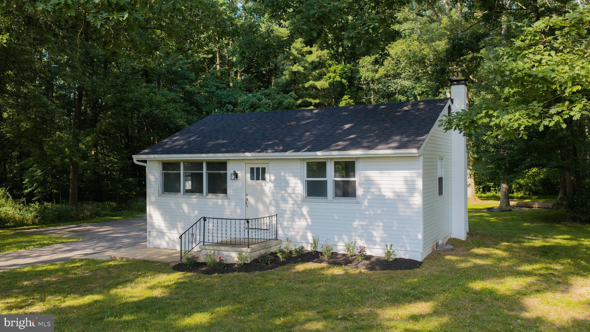 This property is going to onsite auction 8/25/2026 at 5:00 PM and is being sold with reserve. LISTED PRICE IS ONLY A SUGGESTED OPENING BID AND IS NOT INDICATIVE OF THE FINAL SALES PRICE WHICH WILL BE BY SELLER CONFIRMATION DAY OF AUCTION.  Terms: Down payment of $20,000 required day of auction. Settlement on or before October 9, 2026. Transfer taxes to be paid by buyer. Real Estate taxes shall be prorated. 
Updated country ranch home, in a quiet rural setting surrounded by woodland. Preserved farmland borders the property to the rear and adjoining side, with additional farmland directly across the road, creating scenic views and peaceful atmosphere.
This home has bee updated with a beautiful new kitchen featuring granite countertops, stainless steel appliances, new cabinetry, and modern finished. Additional recent improvements include new replacement windows throughout, a new asphalt shingle roof, and fresh interior paint.
A bright attached all-seasons room offers a place to relax, enjoy your morning coffee, or take in the peaceful views of the surrounding countryside. The home also features a full basement with outside access.  Outside you'll find a detached garage with an attached carport, ideal for vehicle storage, equipment, lawn tractors, or recreational toys. The paved asphalt driveway provides parking and easy access, while the spacious yard offers plenty of room for outdoor entertaining and gardening.
This quiet country location is conveniently located **less than 10 minutes from shopping, restaurants, grocery stores, schools, and everyday conveniences**. Commuters will appreciate the quick access to *Route30, Route 10, and Route 340**, making travel throughout Chester and Lancaster Counties a breeze.