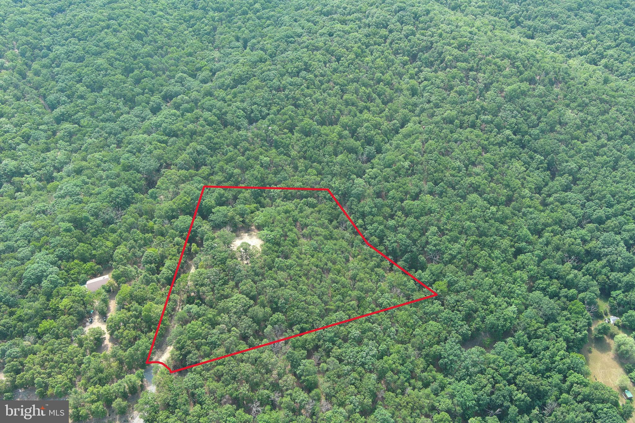 SITUATED IN THE HILLS OF WEST VIRGINIA, YOU WILL FIND THIS  6 ACRE TRACT THAT PACKS A BIG PUNCH IN A SMALL PACKAGE!  LOCATED AT THE BACK OF THE SUBDIVISION,  AT THE END OF A CUL-DE-SAC,  THIS ONE WILL GIVE THE NEW OWNER THAT SECLUDED MOUNTAIN FEEL WITHOUT TRAVELING STEEP, MOUNTAIN, GRAVEL ROADS FOR MILES TO ACHIEVE THE PRIVACY AND SECLUSION THAT MANY ARE IN SEARCH OF.  A BEAUTIFUL BUILD OR CAMP SITE HAS BEEN PREPARED WHICH IS SURROUNDED BY TOWERING HARDWOODS AND WITH A LITTLE MORE CLEARING COULD PROVIDE VIEWS OF THE SOUTH BRANCH RIVER VALLEY AND WHITE HORSE MOUNTAIN IN THE DISTANCE.  THE COMMUNITY HAS IT'S OWN PRIVATE ACCESS TO THE RIVER WHICH IS JUST A COUPLE OF MILES DOWN THE ROAD AND IS POPULAR FOR FISHING, SWIMMING, FLOATING AND KAYAKING.  WHITEHORSE MOUNTAIN WILDLIFE MANAGEMENT AREA IS ALSO A SHORT DISTANCE AWAY, MAKING THIS AREA AN OUTDOORSMAN'S PARADISE.  IF YOU ARE CHECKING THIS ONE OUT ONLINE THEN YOU ARE HALF-WAY TO OWNING YOUR PIECE OF WILD AND WONDERFUL.  FINISH THE OTHER HALF BY MAKING THE TRIP WITH YOUR CHECKBOOK IN HAND AND SEE IT FOR YOURSELF!