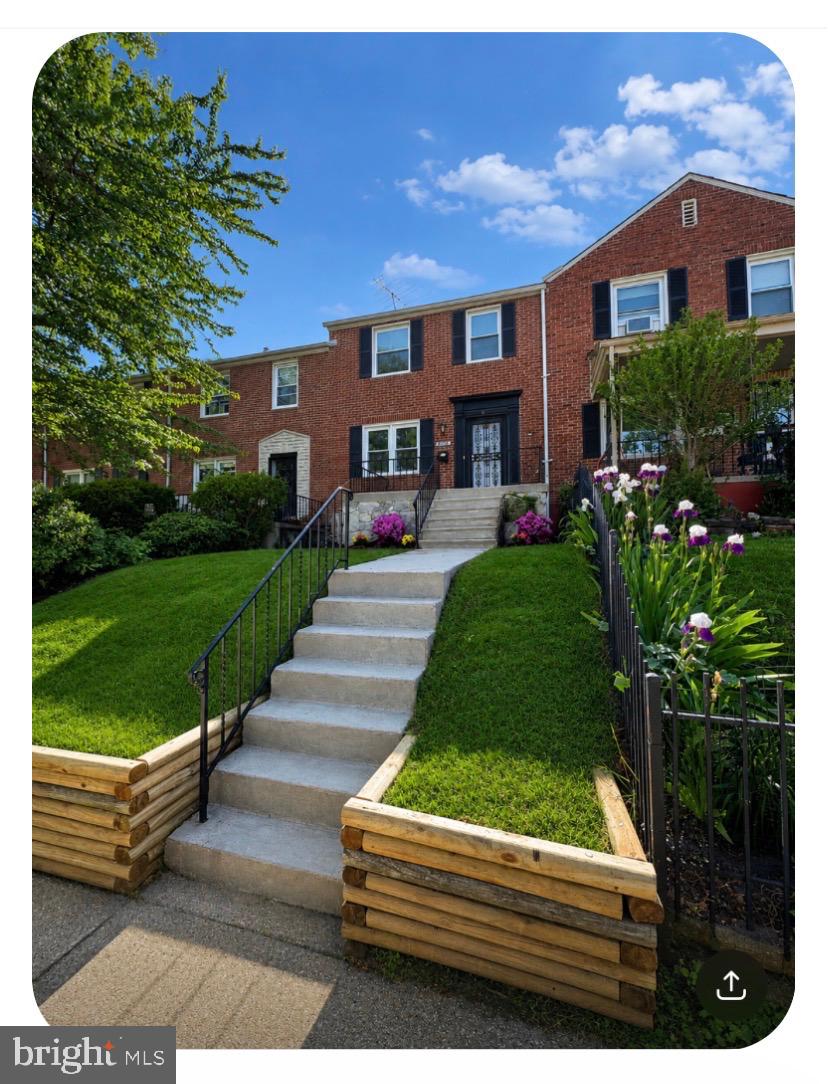 Ascend the stairs flanked by lush green grass and beautiful flowers through the front door to your new oasis. This home features a living room with polished hardwood floors, an updated dining room with new lighting, a galley kitchen with new cabinetry, quartz countertops, and gorgeous stainless steel appliances. Take the stairs to the top floor where you'll be greeted by three beautifully sized bedrooms, each containing its own ceiling fan. The full bathroom has been updated with new lighting and a vanity. Back to the main level and into the basement, you'll be greeted by a large open space that can be used as a family room, kids play area, or man cave. To the rear of the basement you'll find a washer and dryer and a water closet. To the rear of the home, you'll find a fenced in back yard ready to host the first cookout of the summer. Exit the yard to the alley where you'll find a one-car garage. This home is a prime location with Morgan State University and the VA Medical Center nearby.