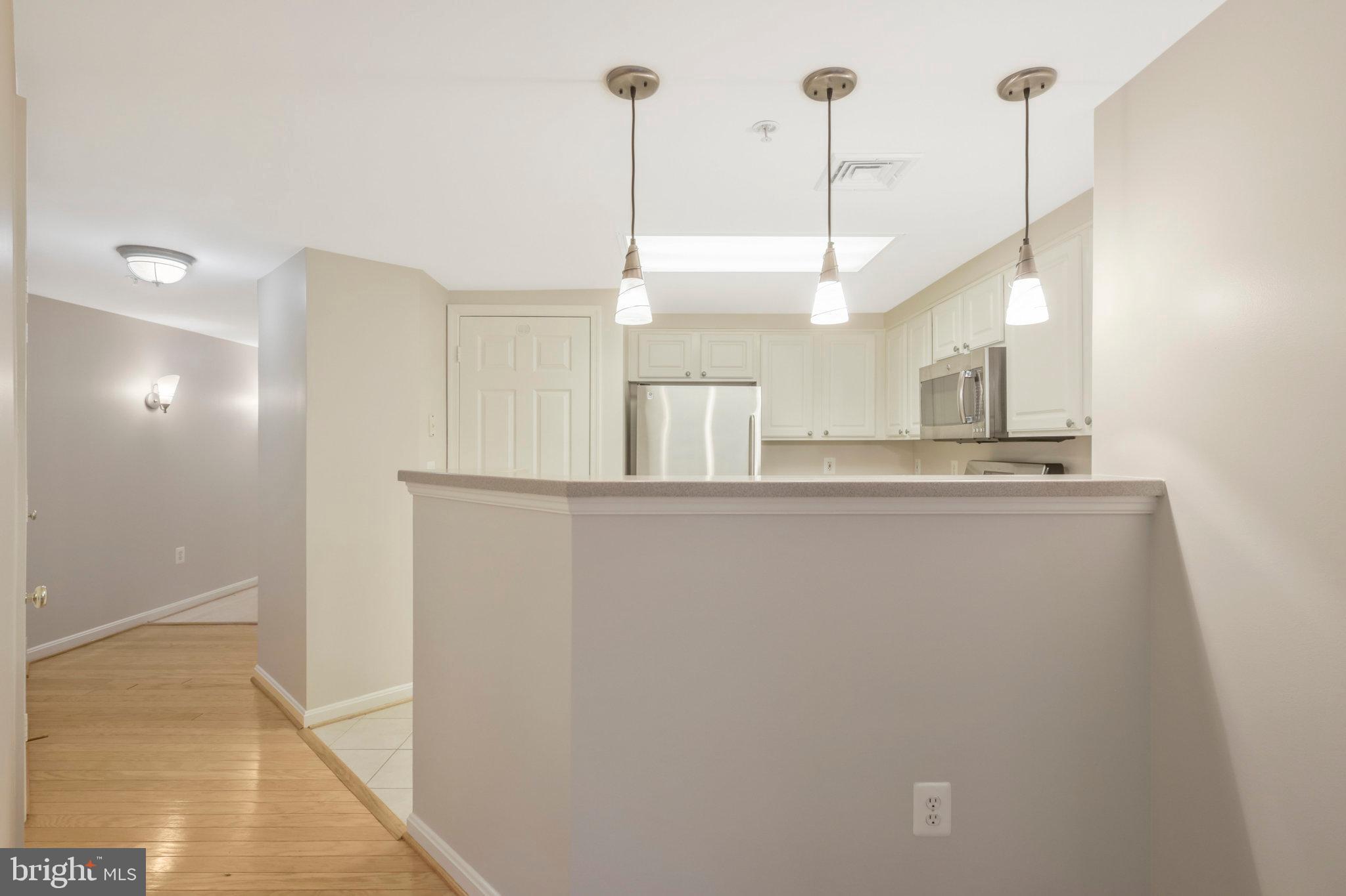 Bright corner unit with extra windows, abundant natural light, split-bedroom privacy, deeded garage parking and extra storage in pet-friendly Lexington Square. Open floor plan, GE Profile stainless appliances, hardwood and marble floors, in-unit washer/dryer, and spacious primary suite with walk-in closet, whirlpool tub, and separate shower.

Exceptional amenities include pool, hot tub, fitness center, party room, grilling area, and bike storage. A true Walker's Paradise—quietly tucked away yet just steps to Ballston and Virginia Square Metro, parks, Farmers Market, Ballston Quarter, dining, shopping, and everyday conveniences.