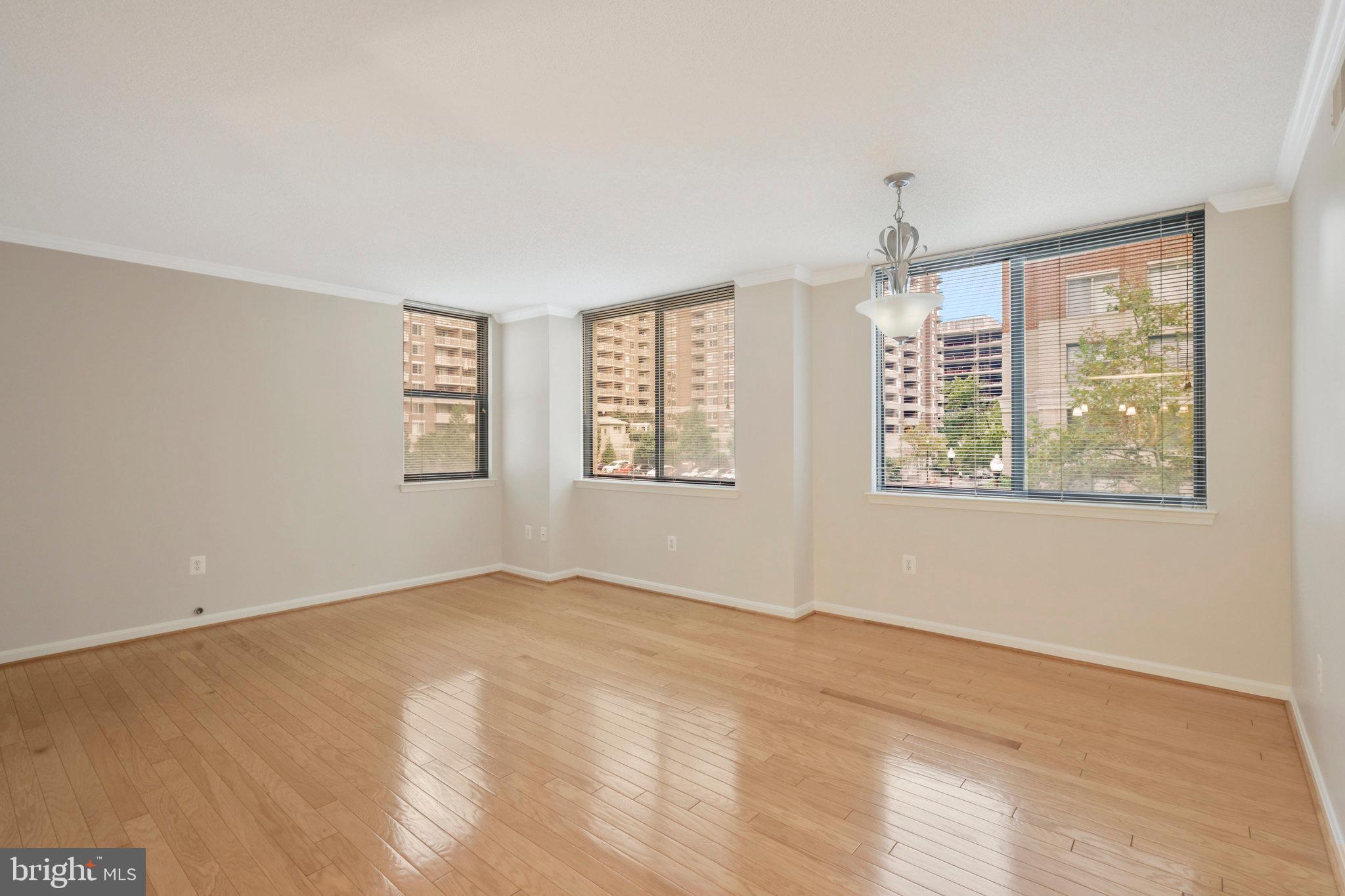Corner unit.  Extra windows for abundant dazzling  natural light.  Split B.R.'s and Baths provide maximum privacy and optimum work-from-home space.  Ultra-desirable Lexington Square known for its prime Metro-friendly location and luxury amenities.  Walker's Paradise.  Easy to  live without a car  (or leave yours in your own deeded garage space). Classy, solid and secure building ultra-close-in  yet tucked away in a quiet and serene Ballston/Virginia Square location mere steps to Metro Stations, parks, Farmers Market and every convenience and service imaginable.   G.E. Profile stainless appliances.   In-unit Washer/Dryer.  Marble and hardwood floors; carpeted bedrooms. Deeded secure Garage B1-331 and generous Extra Storage  on B2; Rm. 2; #234.  Kitchen open to Living Room/Dining Room.  Walk-In ckloset in Primary Bedroom and Primary Bath has both whirlpool tub and separate shower.   Bedroom #2/Den/Office is secluded from Primary B.R. and has its own adjacent Full Bath#2.    Could you use more garage parking?  Handy public Garage just next door for additional flexible garage parking and parking sometimes available from a Lexington Sq. neighbor not using their garage spot.  Convenient to every imaginable service and shopping:  Groceries, Movies, Ballston Quarter, Arlington Central Library, Banks, Cleaners, Eateries, Physicians, Dentists and on and on.  Spacious  Fitness Center, Party Room, Pool/Hot Tub, Grilling and Picnic areas.  Your own garage space and extra storage...even bicycle storage.  Affordable luxury in a golden location.  Leafy Oakland Park one block to the East.