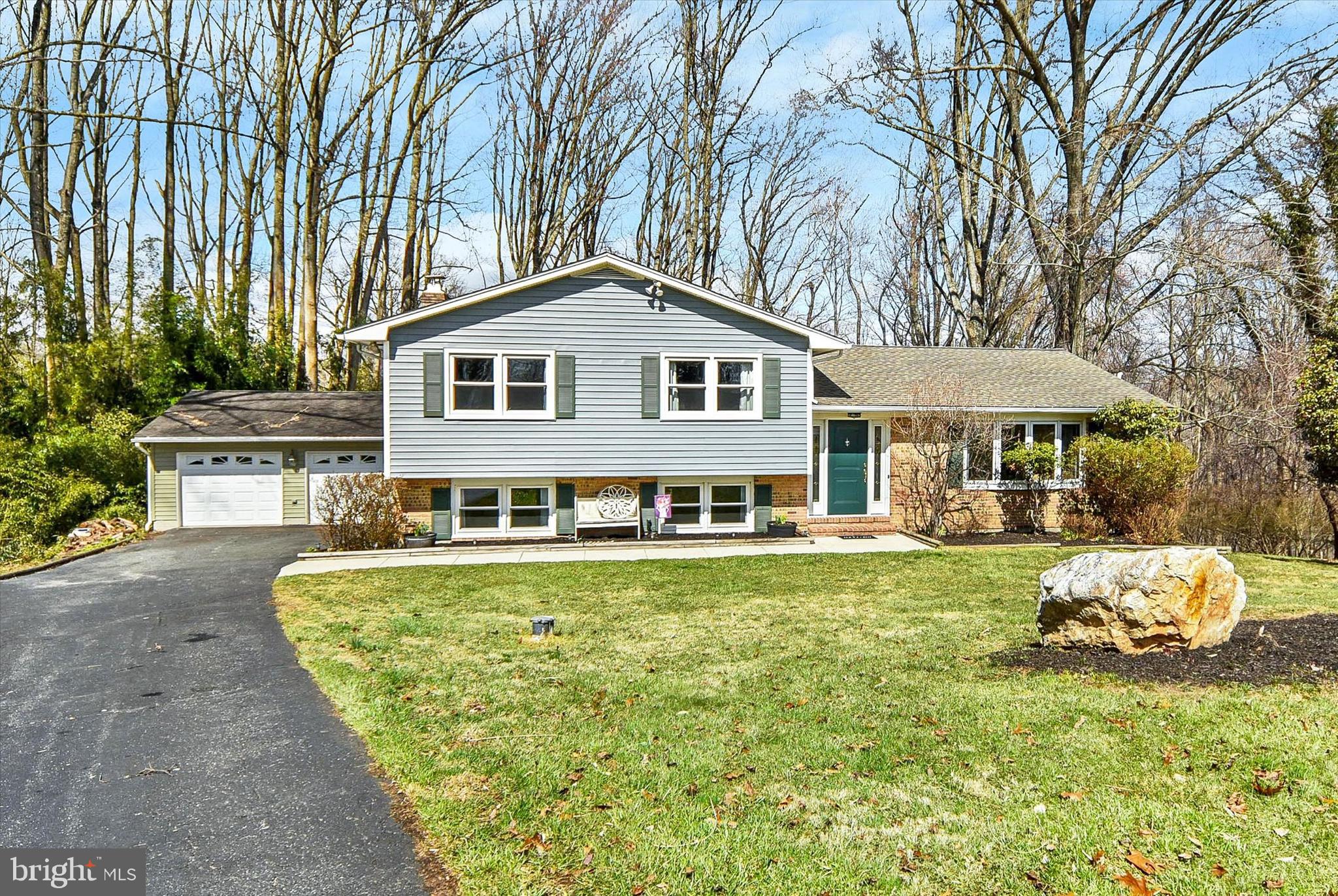 ******NEW LOW PRICE AND SELLER OFFERING $10,000 IN CLOSING ASSISTANCE**** Welcome to 1504 Groveton Court in Fallston—a beautifully updated, move-in ready split foyer tucked at the end of a quiet cul-de-sac, offering privacy, space, and serene wooded views.

Step inside to a welcoming foyer with a convenient drop zone for coats and shoes, setting the tone for the home’s functional and inviting layout. The main level features a bright, airy living room filled with natural light, complemented by gleaming refinished hardwood floors (2021) and a soft, neutral color palette. The adjoining dining room showcases a stylish light fixture and seamless flow—perfect for both everyday living and entertaining.

The spacious kitchen offers abundant cabinetry, generous counter space, and a window overlooking the peaceful backyard—ideal for keeping an eye on outdoor activities while cooking. 

Upstairs, you’ll find four generously sized bedrooms, each with great natural light and ample closet space, along with a well-appointed full bath featuring dual sinks and a tub/shower combination.

The lower level is an entertainer’s dream, featuring a large, cozy recreation room with a charming brick fireplace, custom wet bar, and sliding glass doors leading to the expansive multi-tier deck—perfect for indoor/outdoor entertaining. This level also offers incredible flexibility with an additional bedroom and a spacious second primary suite complete with a massive walk-in closet (featuring a custom built-in shelving system and lighting, June 2025) and a private en-suite bath with dual sinks.

Outdoor living truly shines here, with multiple deck levels ideal for relaxing, hosting, or enjoying the tranquil, tree-lined backyard. The detached two-car garage and long asphalt driveway provide ample parking and storage.

Additional highlights include dual living spaces for added flexibility, five total bedrooms, and numerous thoughtful upgrades: a high-efficiency Bosch HVAC variable system (2022), premium vinyl siding (2023), whole house water softener (2023), new well tank and components (2025), updated lighting throughout (2024), and a garage door opener (2024).

Offering space, comfort, and a peaceful setting—all in a sought-after Fallston location—this home is the perfect blend of functionality and charm. This one won't last long! Schedule your showing today!