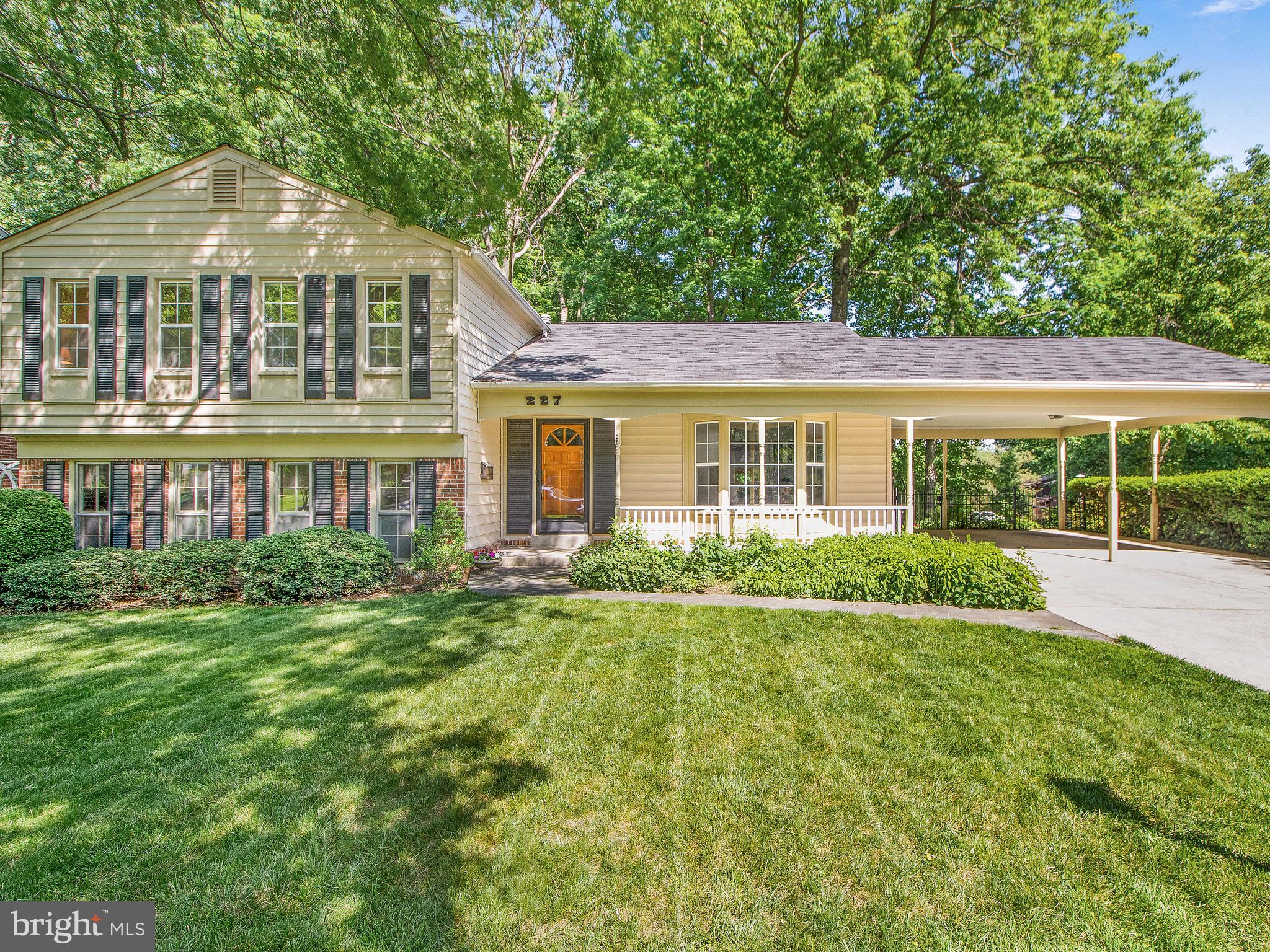 You Will Love this Spacious, Light-Filled Split-Level Home Perfectly Sited on a Corner Lot.  This Home Boasts 5 Bedrooms with 3 Full Baths on 3 Finished Levels with a Partially Finished Basement.  As you approach this Wonderful Home you are Greeted by a Stone Walkway and a Covered Front Porch Area that Leads to a  Large Carport with space for Two Cars.  Upon Entry you are Graced with Newly Refinished Hardwood Floors and a Sprawling Living Room Area.  The Bright Kitchen has Granite Counter Tops and a Bay Window with a Generous Eating area.  The Kitchen Opens to a Separate Dining Room and a Beautiful Sunroom Addition. The Upstairs Level has a Master Suite with a Walk-In Closet, Three Additional Bedrooms and a Shared Hall Bath.  From the Main Floor you will Step down into a Large Family Room with a Brick Hearth and Gas Fireplace. On this Level you will Find an Additional Bedroom and a Large Room that Neighbors the Laundry and Can be Used as an Office or Craft Room.  The Partially Finished Basement has a Large Well-Lit Living Space and Ample Storage.  The Backyard is Gorgeous with a Deck, Tons of Garden Beds, Nice Shrubbery and Mature Trees.  Freshly Painted with New Carpet & Move-In Ready, On a Fantastic Lot, with Parks Close by, AND in a Great Location Close to Town, This Home is an Absolute Winner!!