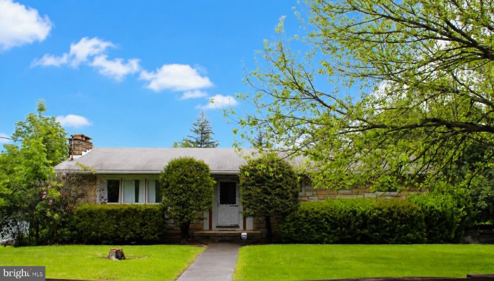 Enjoy the great location of this stone rancher - Family owned for decades - Features hardwood floors, 3 full baths, a wood burning fireplace in the living room and lower level family room - Pull right in to the basement 2 car garage and walk directly in and not get wet - Need a workshop, we got you covered. Come take a look at the 26 by 34  detached workshop with a rubber roof - This building could also be an additional garage with the addition of a garage door - There is a commercial grade water heater - A small fenced area that could be used for a garden or pets - Located minutes from A T K, shopping, restaurants, and only 3 miles to Lavale and Cumberland - Do not miss this one, ranchers are far and few between.