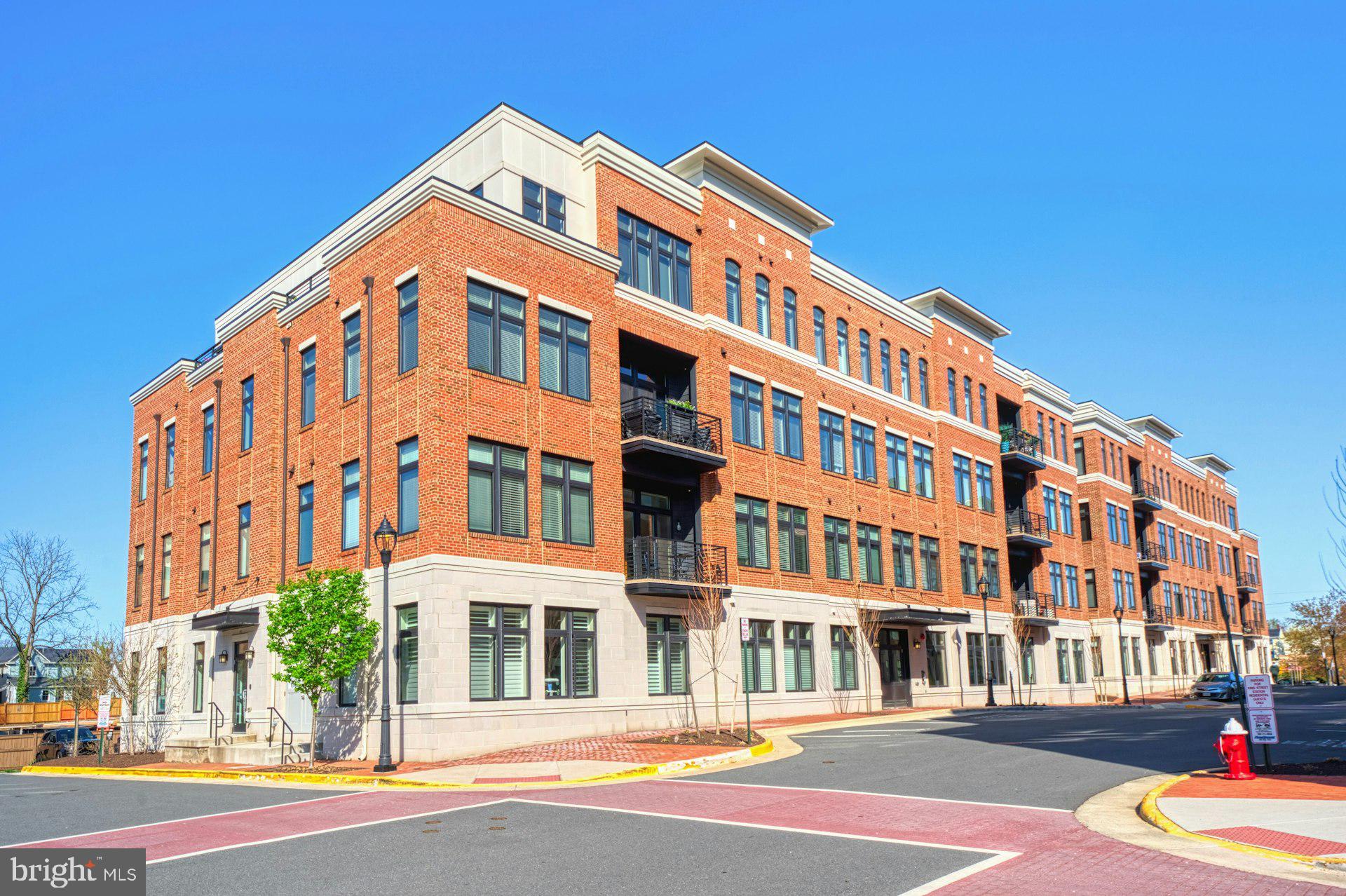 Sophisticated Penthouse Living in the Heart of Historic Downtown Leesburg!

Welcome to an extraordinary residence in King Street Station, where timeless charm meets contemporary elegance. This rare luxury penthouse condo has been masterfully enhanced with over $100,000 in bespoke upgrades, offering 1,625 square feet of refined, single-level living in one of Leesburg’s most coveted boutique communities.

Every detail has been thoughtfully curated—from the wide-plank engineered hardwood flooring to the designer tilework, custom cabinetry, and sleek Silestone countertops with a coordinating tile backsplash. A stunning fireplace anchors the open-concept living space, where 10-foot ceilings and expansive windows bathe the interiors in natural light.

Elevated touches abound: designer wallpaper, Hunter Douglas motorized blinds, custom closets and pantry systems, and a large private roof terrace complete with a motorized retractable awning—ideal for effortless indoor-outdoor entertaining. An Electrolux washer and dryer are discreetly tucked into the unit for convenience, and an assigned oversized garage with custom built-ins is just an elevator ride from your door.

Set along the scenic W&OD Trail, King Street Station offers professionally landscaped grounds featuring a community pavilion, terraced lawns, and tranquil garden spaces. From your doorstep, stroll to local favorites like GooseCup Coffee, boutique shops, art galleries, and award-winning dining, all within the vibrant fabric of Historic Downtown Leesburg.

With close proximity to commuter routes and Dulles International Airport, this exclusive offering perfectly balances lifestyle, location, and low-maintenance luxury.